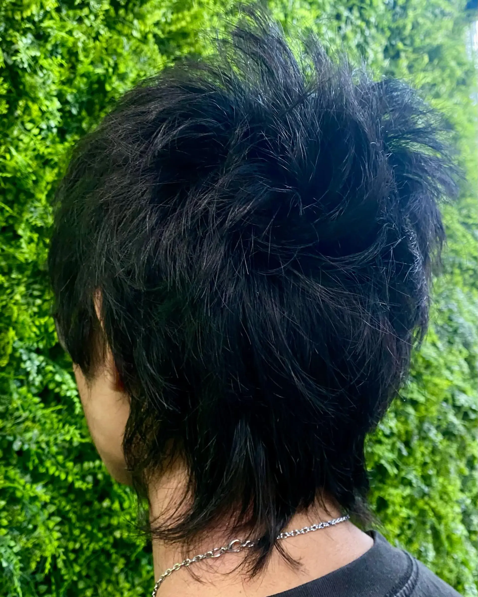 A shaggy, layered mullet with a textured and choppy finish. 2