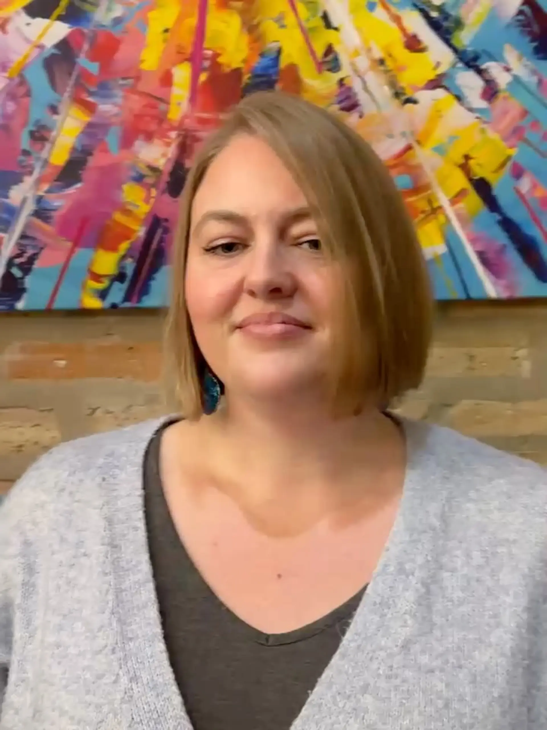 A sleek, chin-length blunt bob with a side part styled smooth and straight. 1