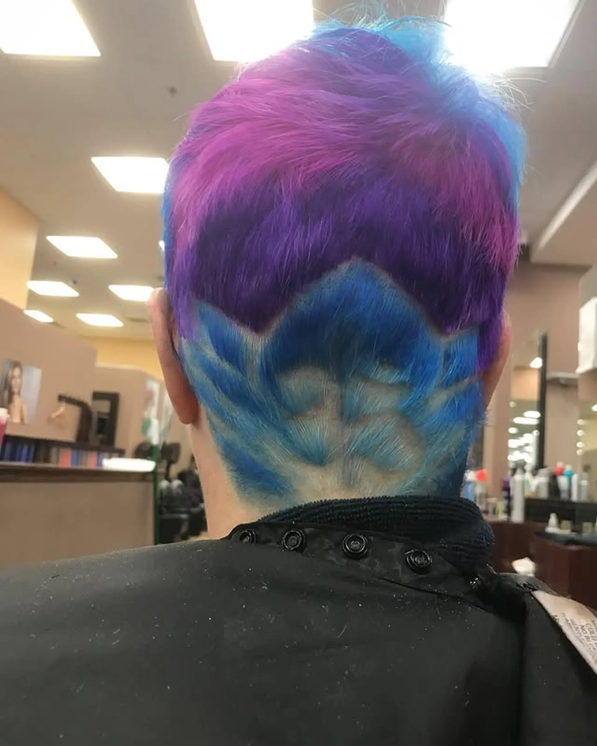 Short pixie with an undercut and a unique color blocking pattern. 1