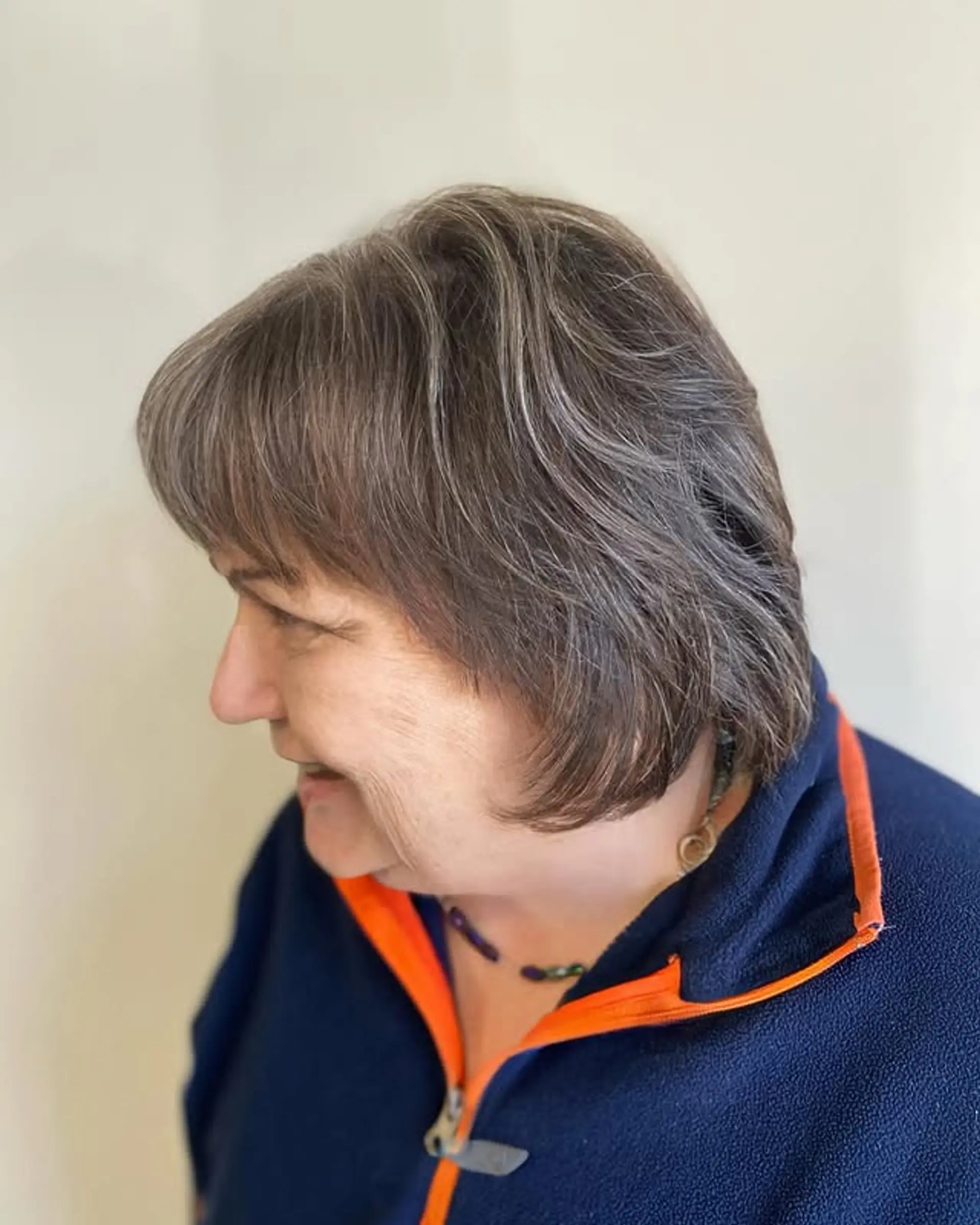 A timeless layered bob with subtle silver highlights, creating a soft and sophisticated look. 1