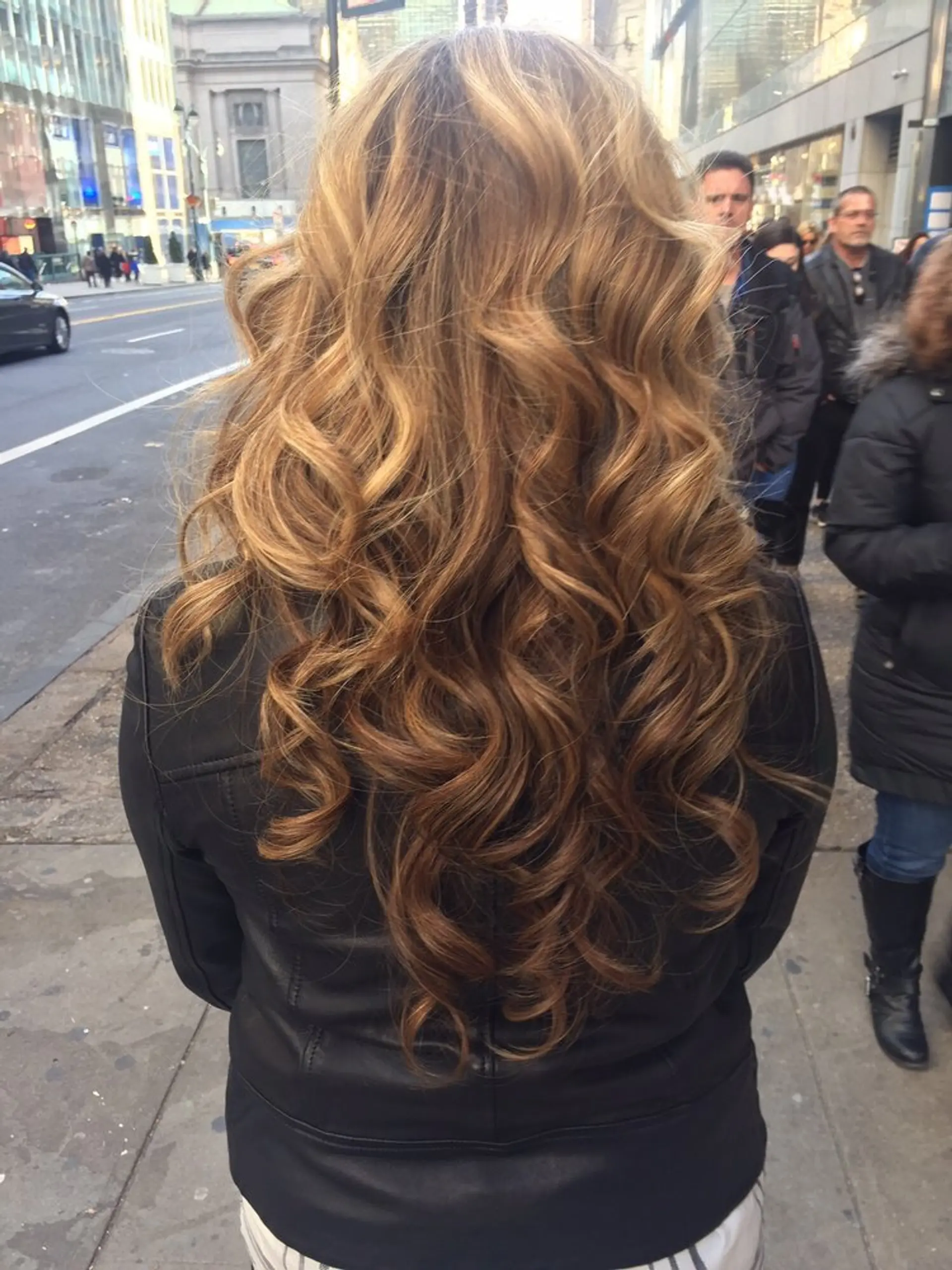 Long, voluminous waves with a honey blonde balayage. 1