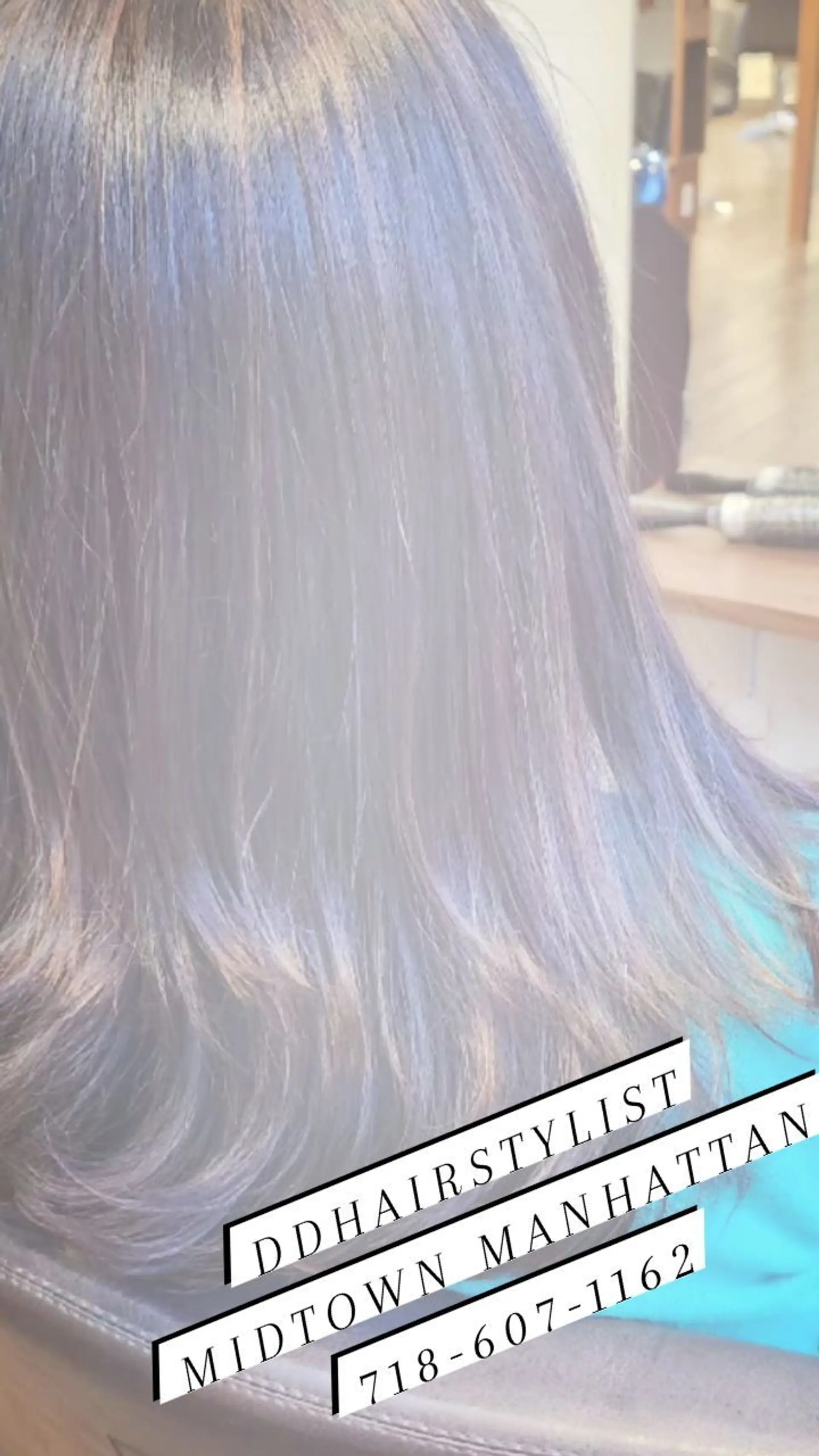 Medium-length dark brown hair cut with subtle soft layers and finished with a smooth blowout. 1
