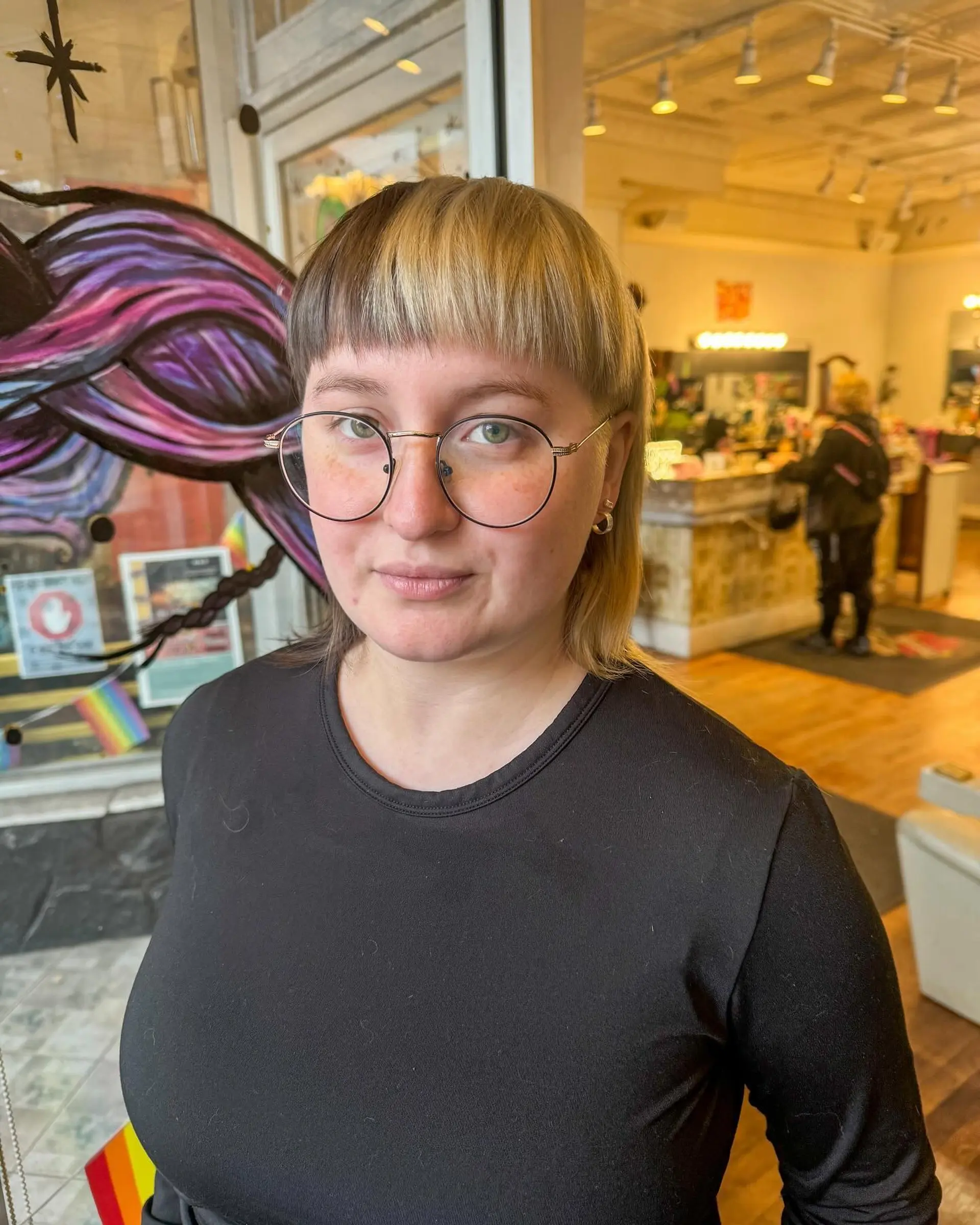 A two-tone split dye mullet with straight hair, featuring a platinum blonde and dark brown contrast. 2