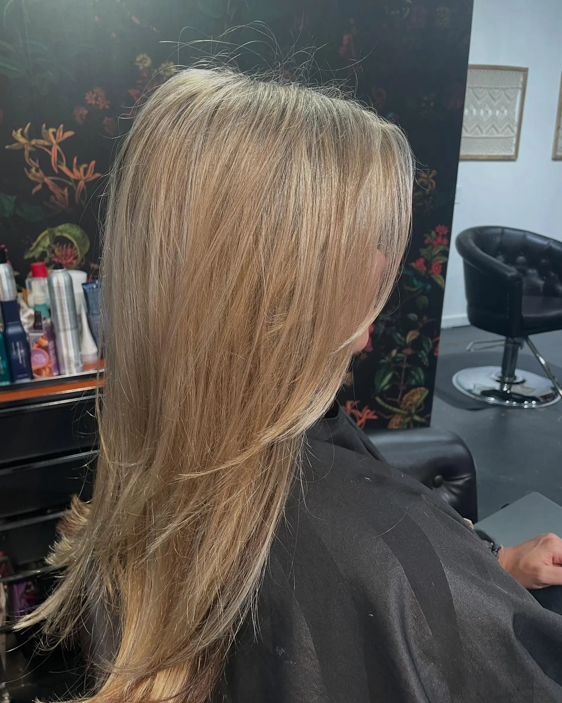 Long straight blonde hair with multi-tonal highlights and soft, face-framing layers. 1