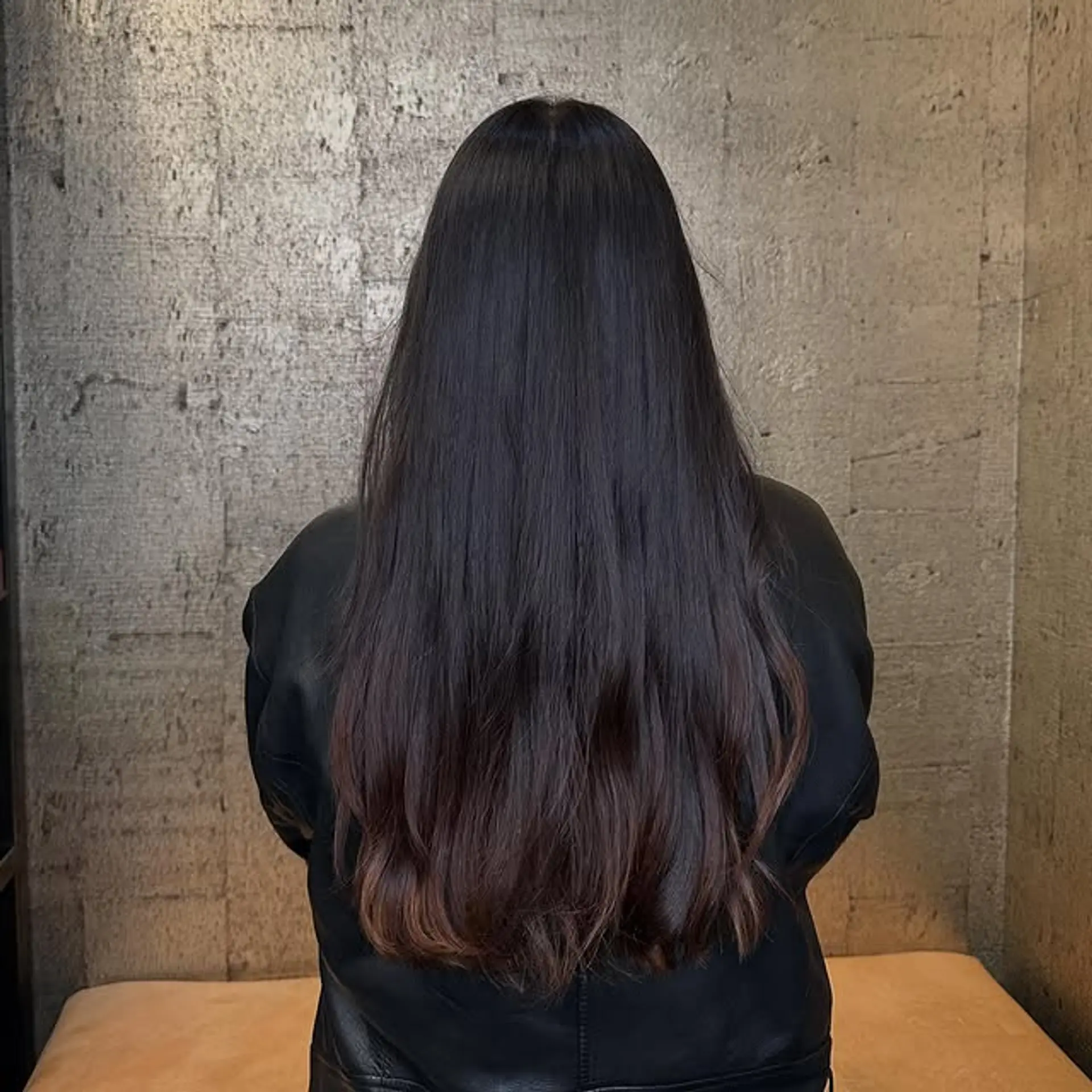 Long, straight hair with subtle layers and a soft black to brown ombre. 1
