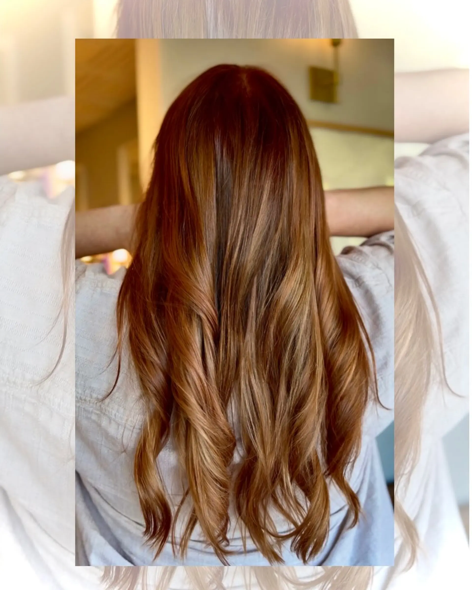 Rich, multi-tonal copper hair worn long with soft waves through the lengths and ends. 1