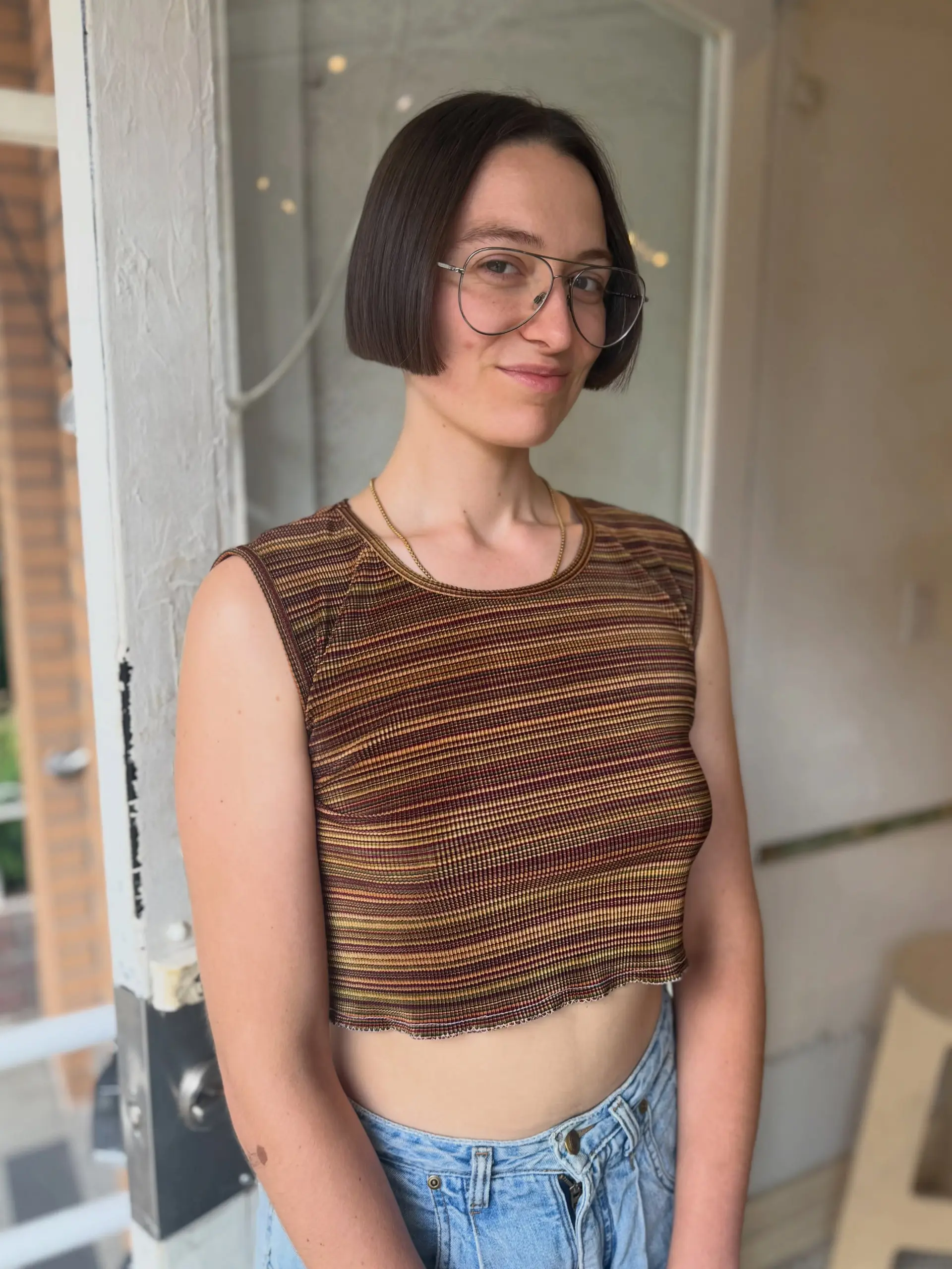 A sleek, sharp jaw-length precision bob with blunt ends and a clean center part. 1