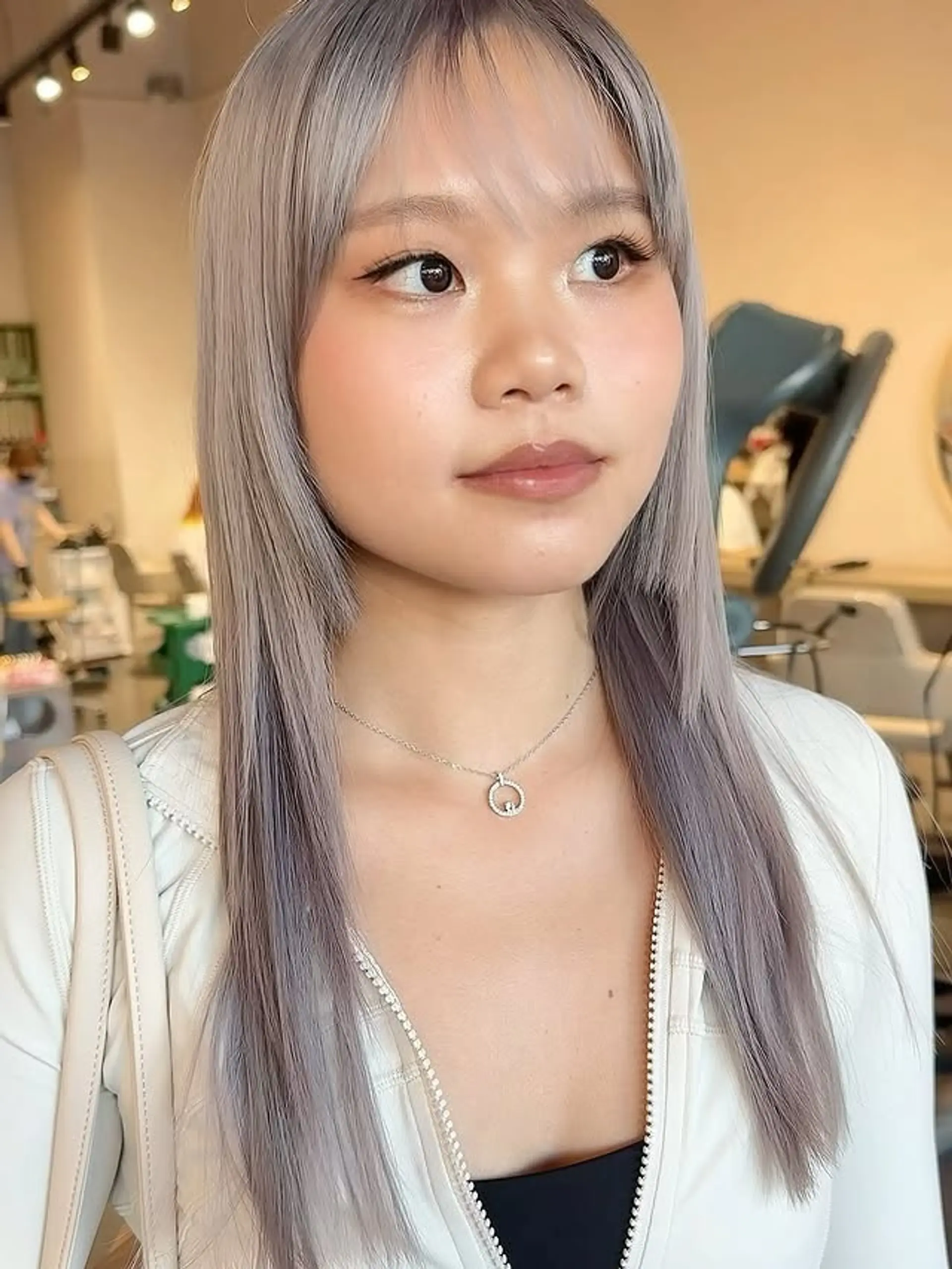 A layered shag haircut with curtain bangs. 1