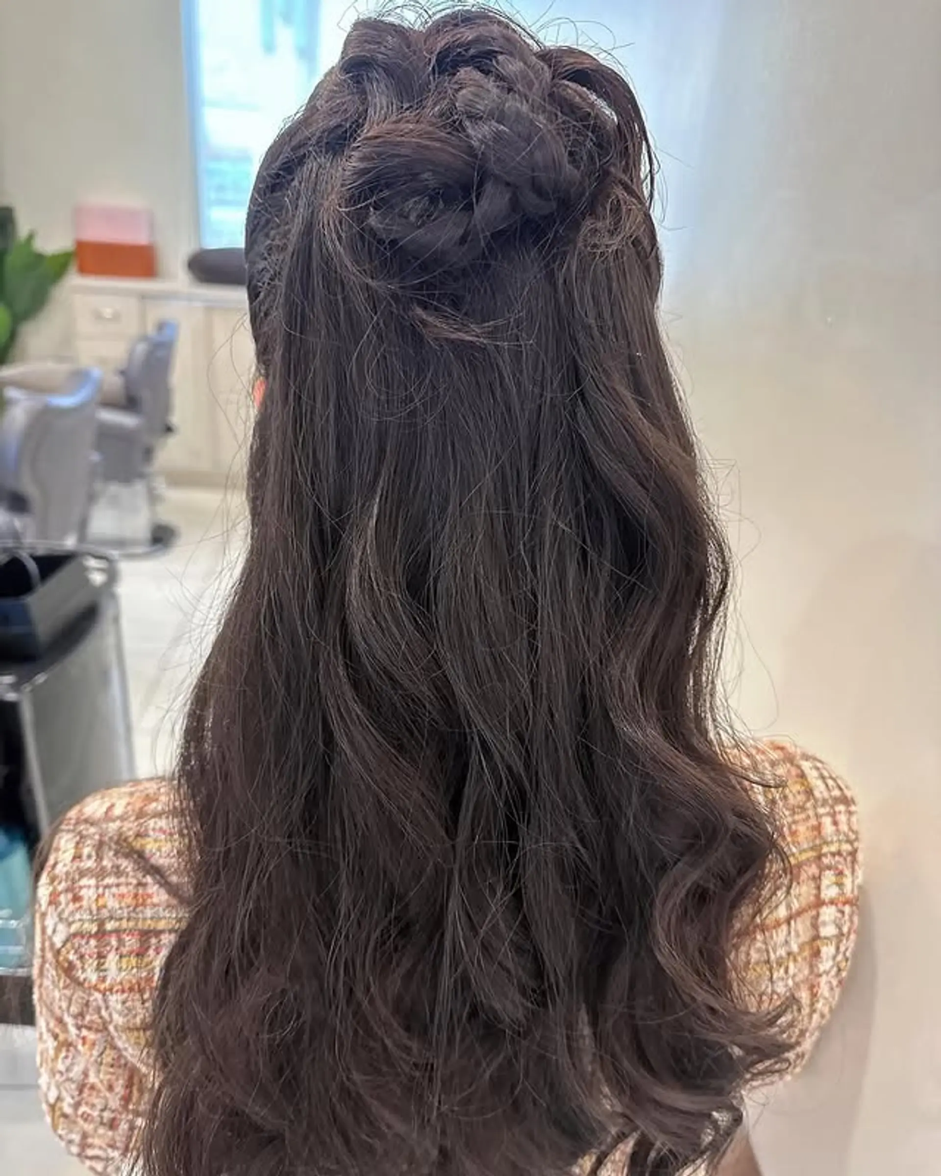 A beautiful braided crown updo with long, flowing waves. 1