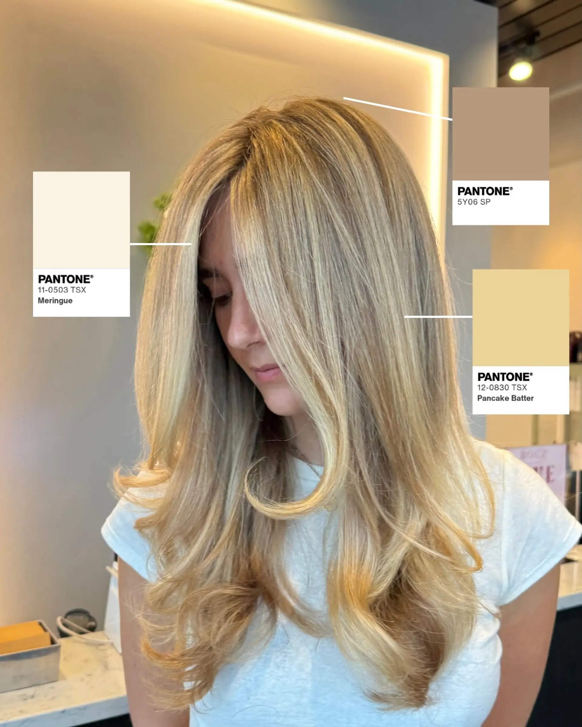 Long dimensional blonde hair styled into a voluminous blowout with soft, curling face-framing layers. 1