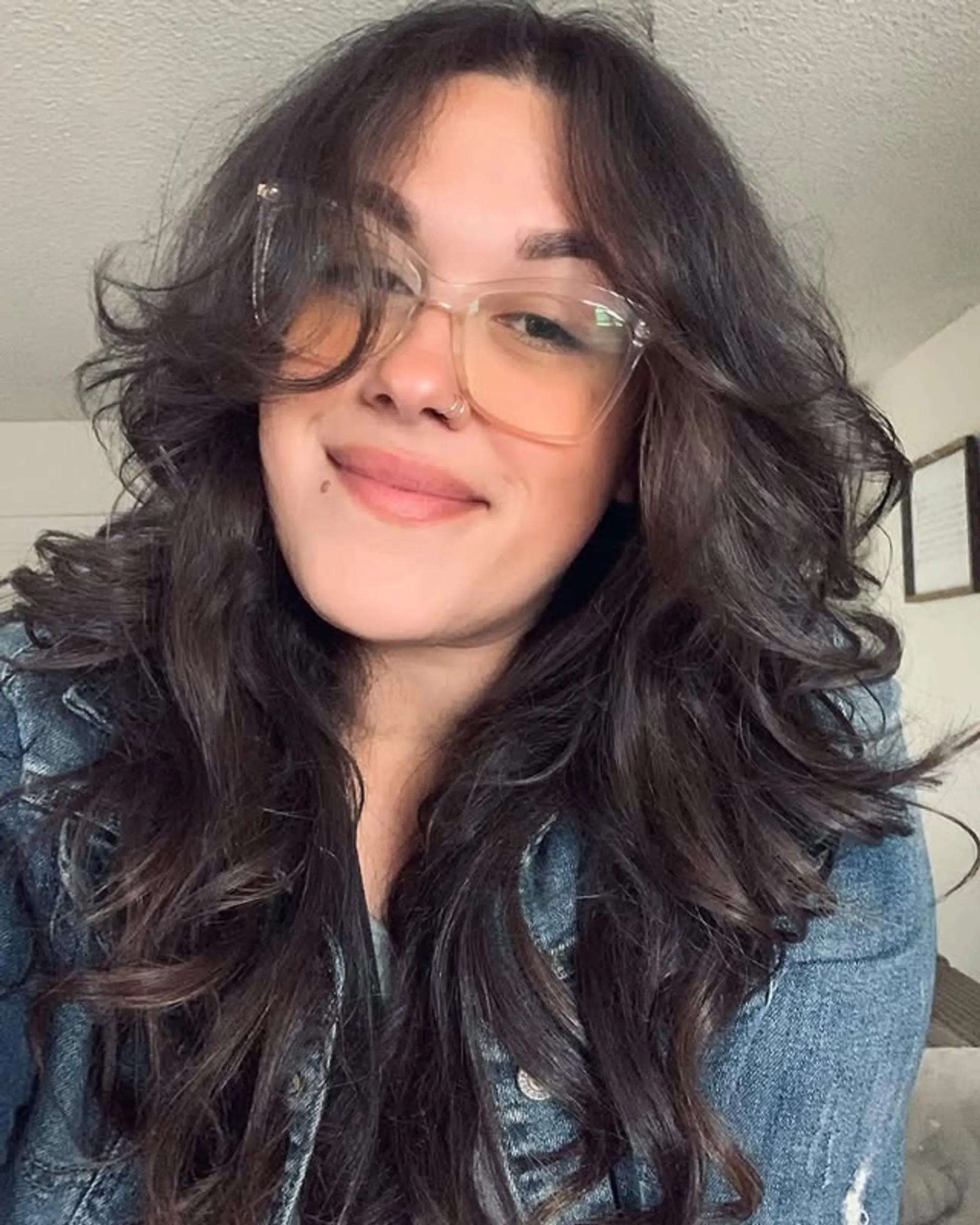 This is a medium length layered haircut with volume. 1