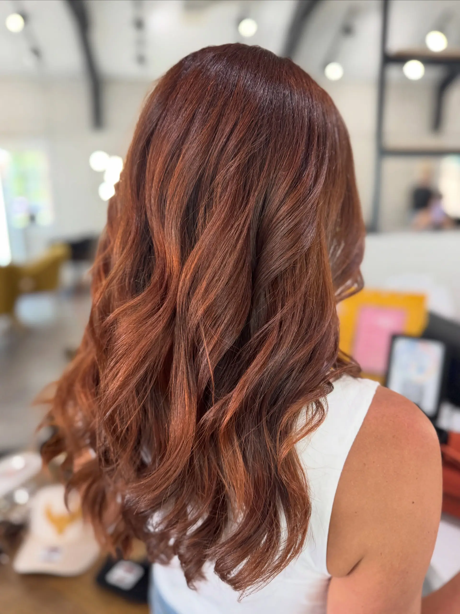 Long cinnamon copper hair styled in soft, loose waves with rich dimensional warmth. 1