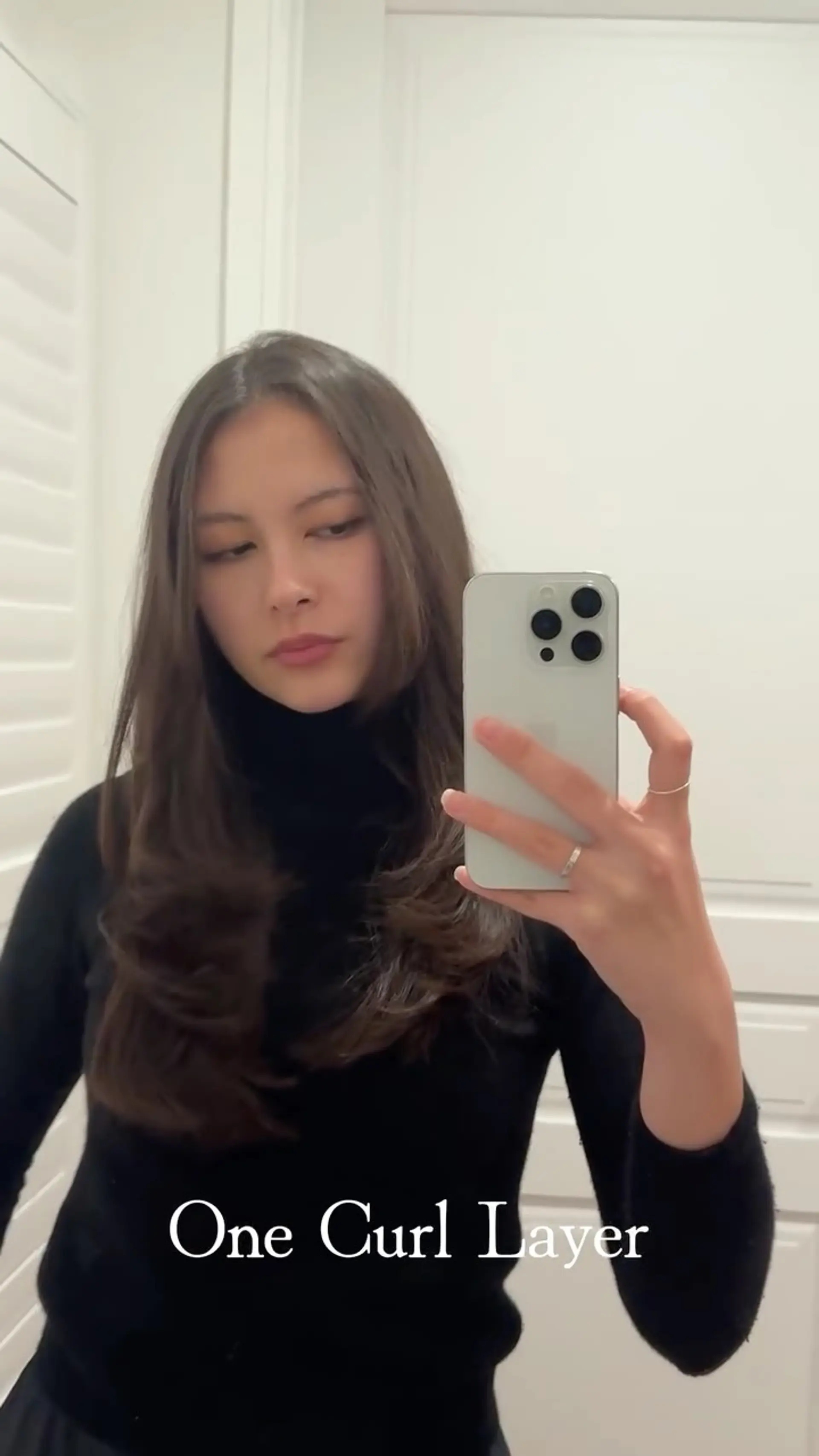 A versatile long layered haircut styled with soft inward-curling ends and face-framing layers. 1