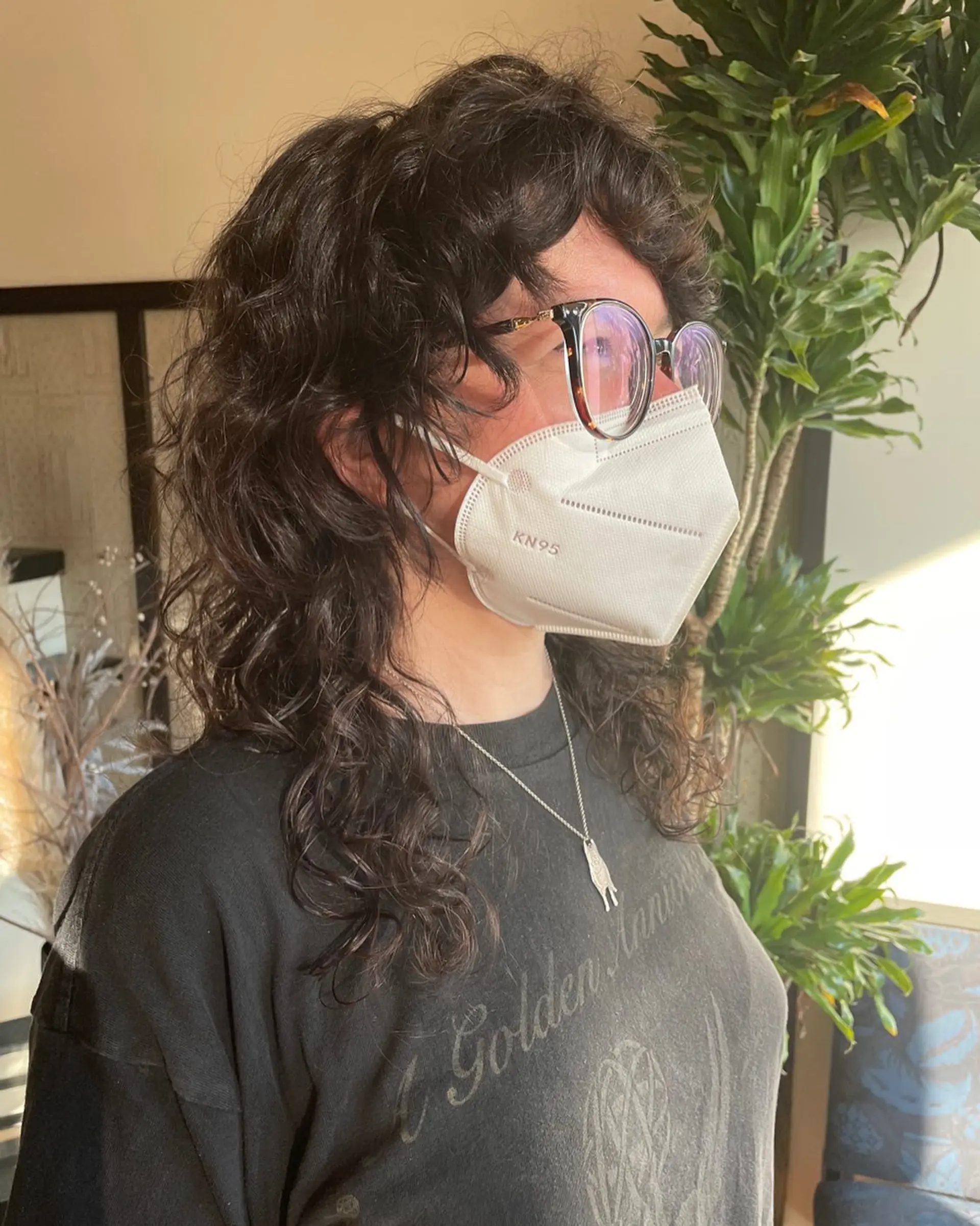 A medium-length shag haircut with layers to enhance natural curls. 1