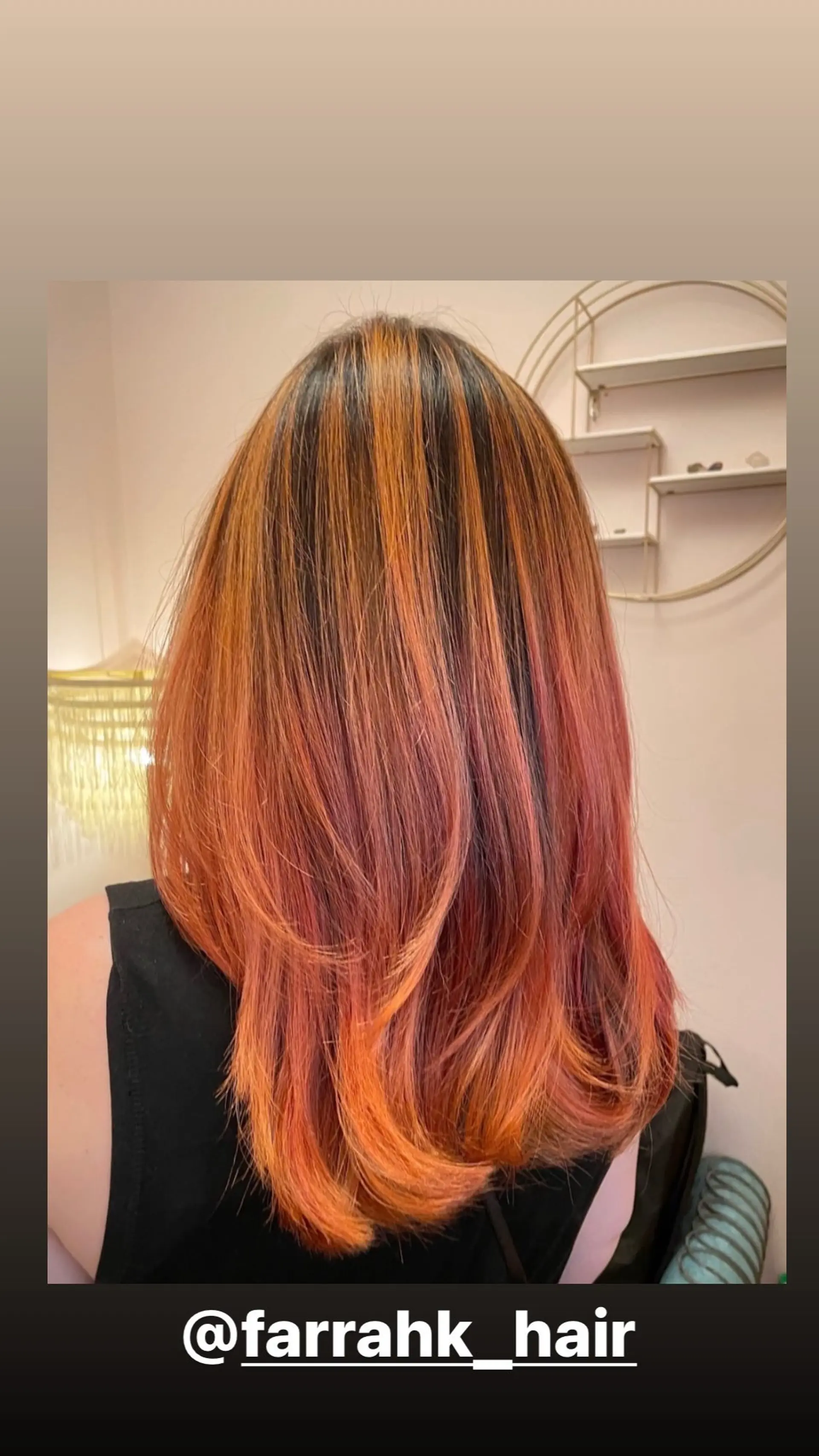 A layered lob with a vibrant copper sunset balayage. 1