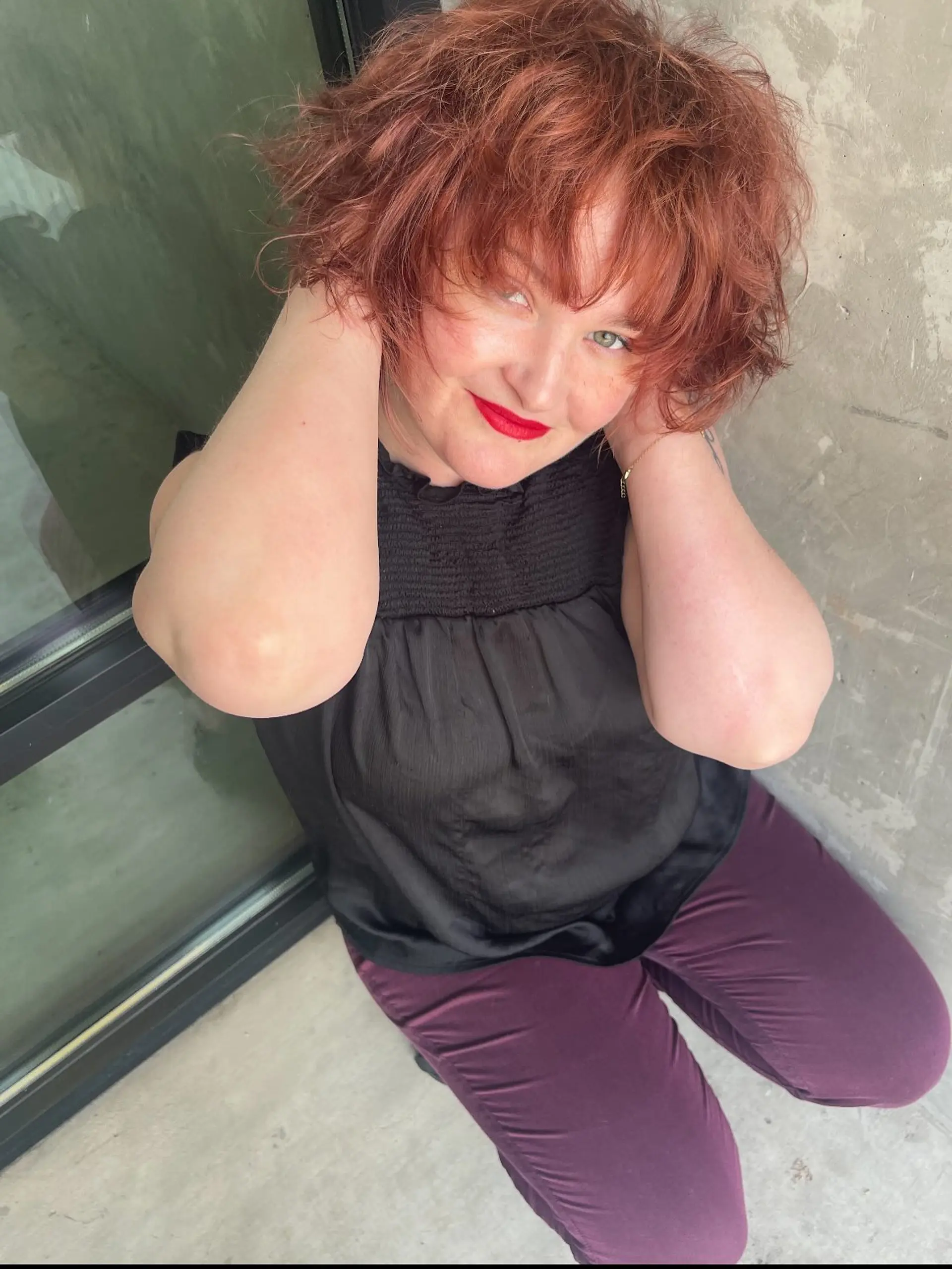 A voluminous, tousled copper-red shag haircut featuring textured layers and full, choppy bangs. 1