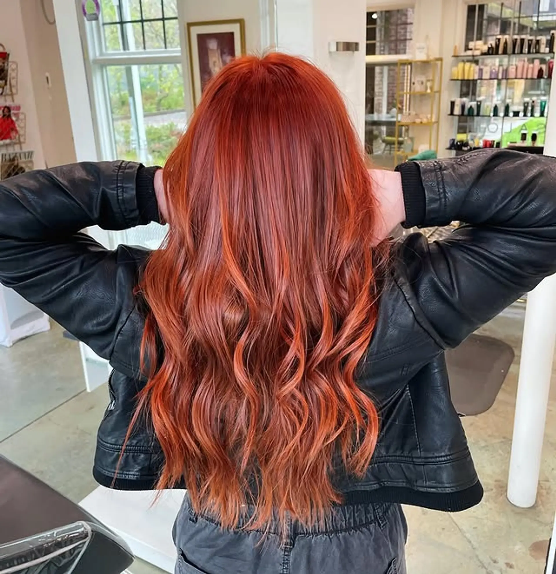 Long, wavy hair with layered copper and red balayage. 1