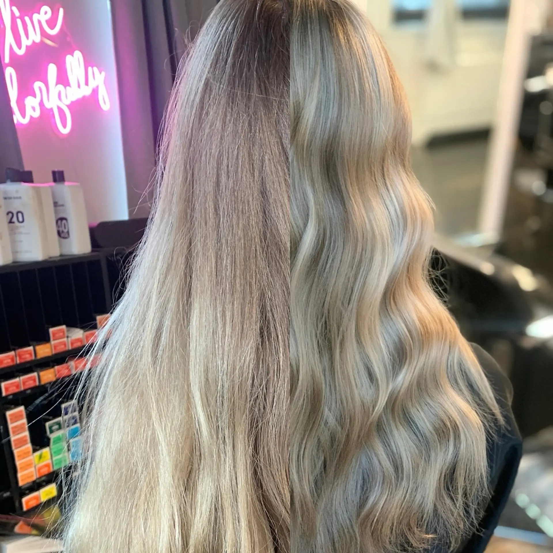 A split before-and-after view showcasing a transition to a glossy, cool-toned blonde styled in soft waves. 1