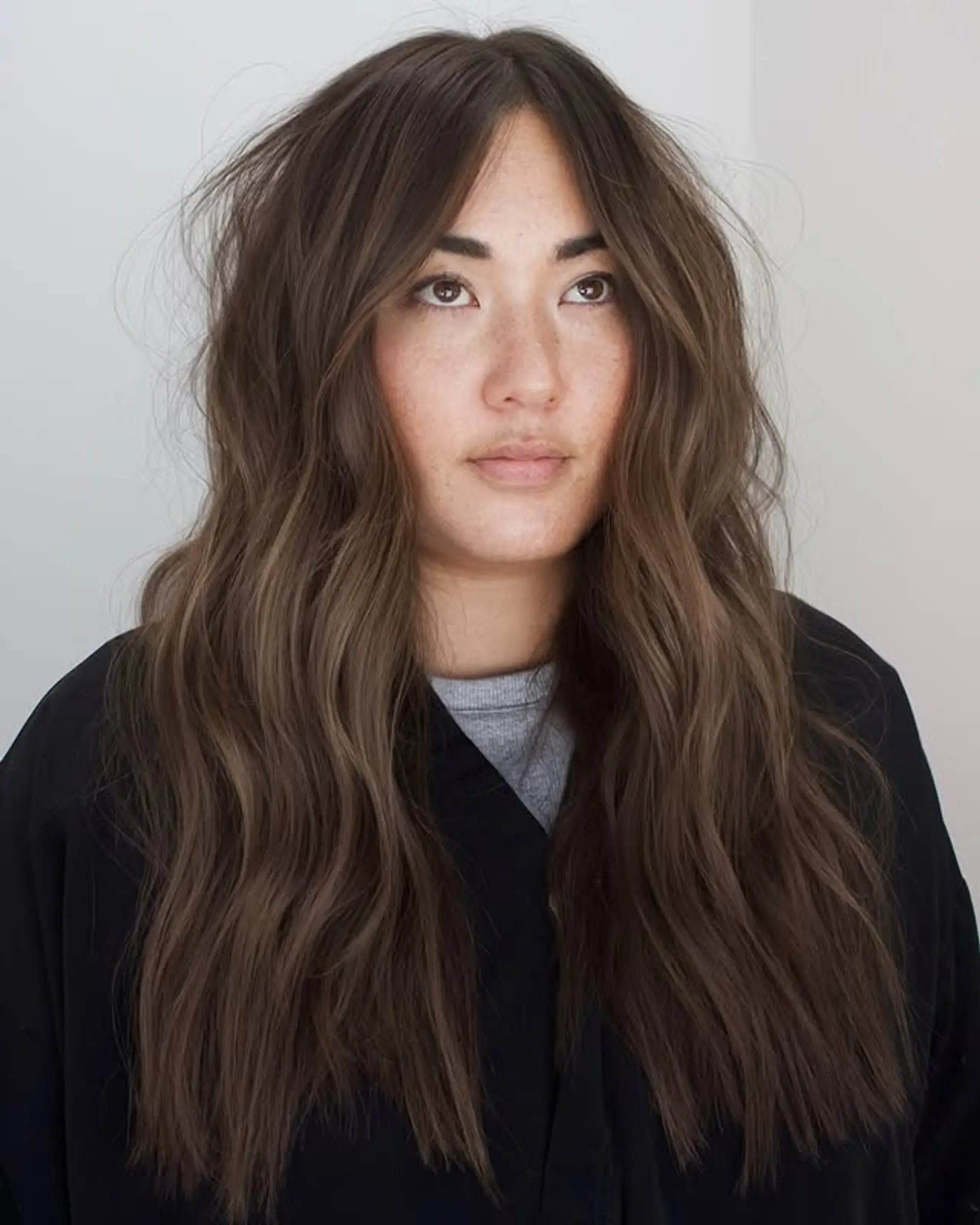 Long, wavy hair with a subtle balayage. 1