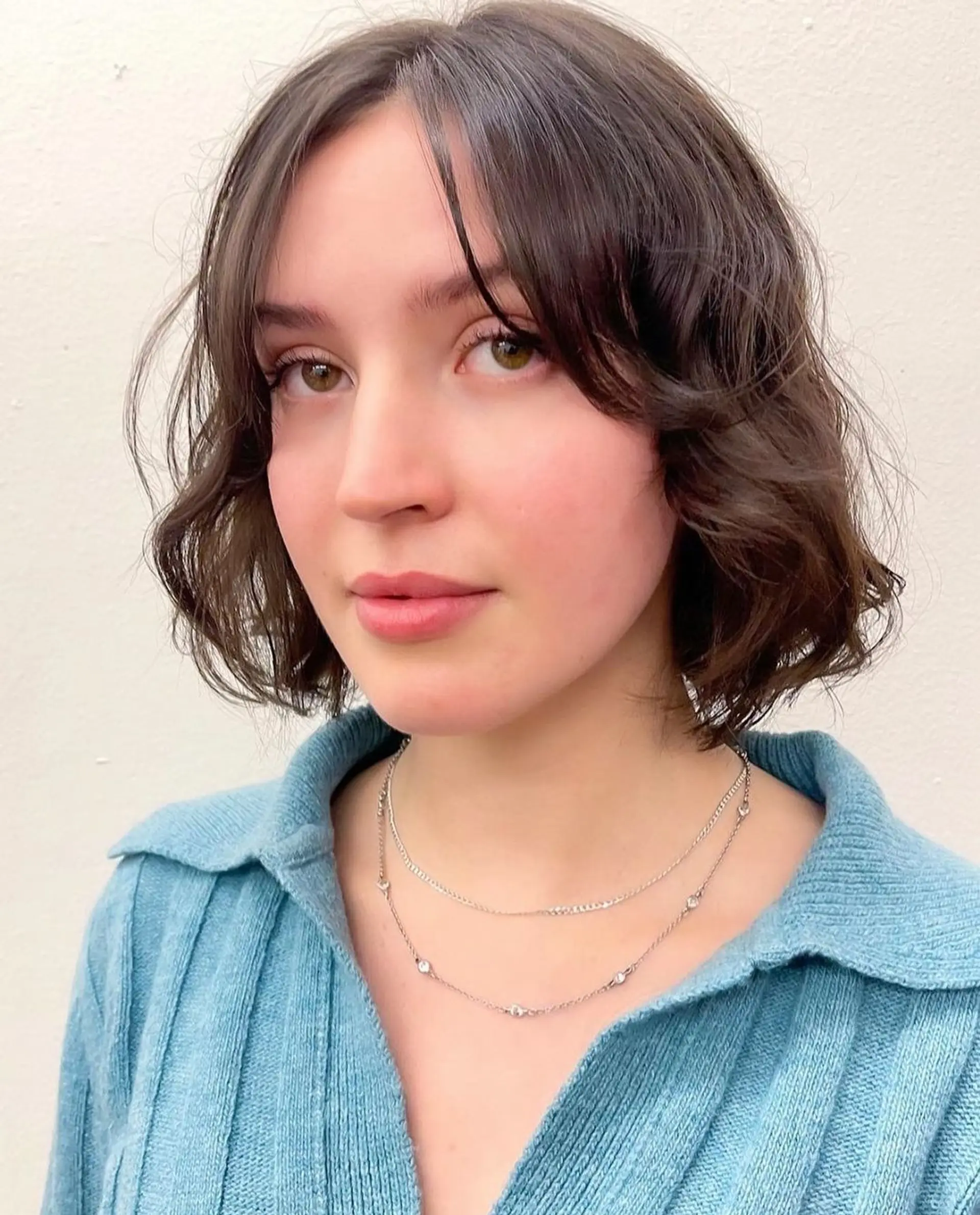 A chin-length bob with soft, wavy brown hair, featuring loose waves and a middle part for a casual elegance. by @kotomiacacio__hair 1