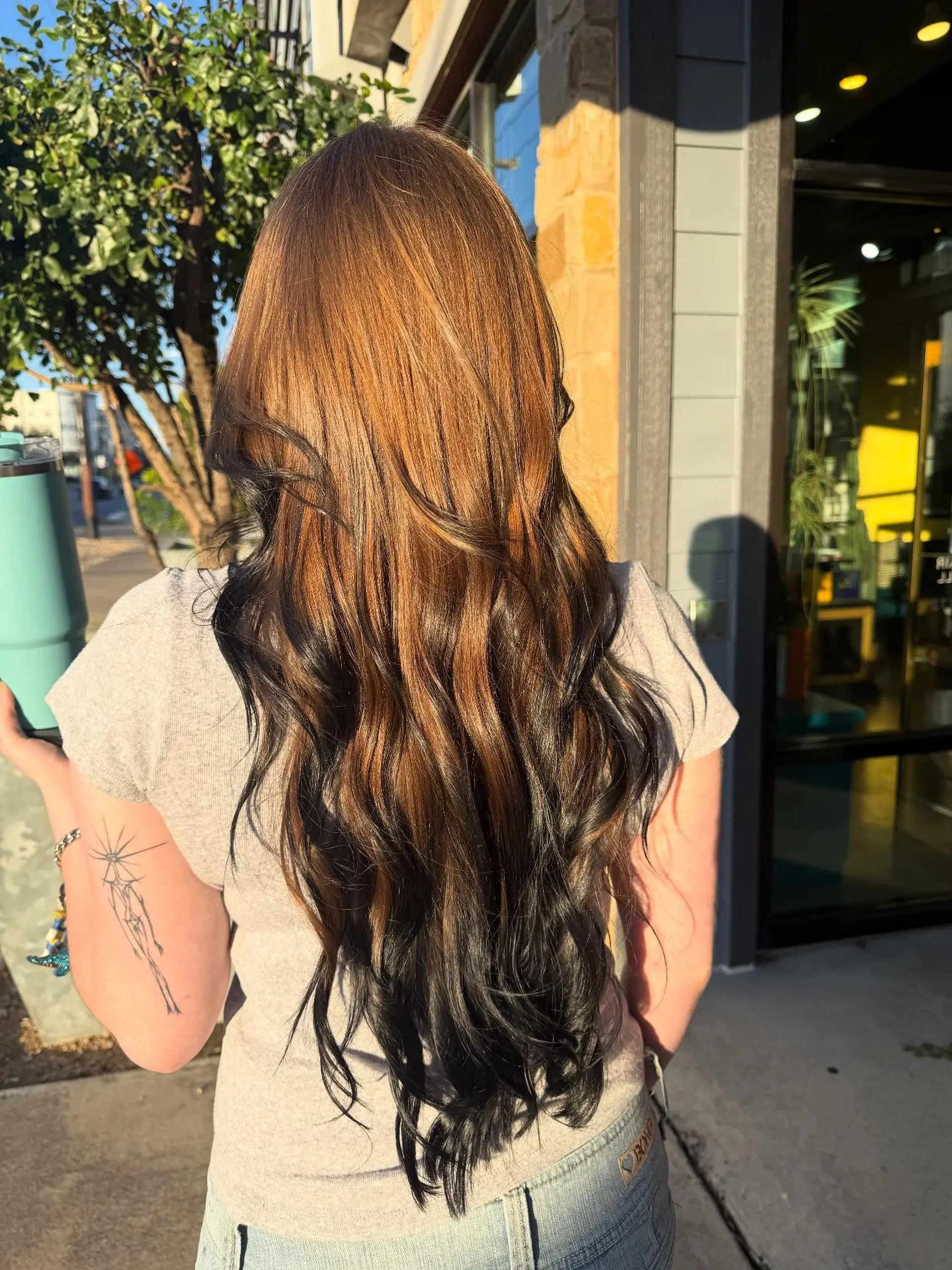Very long, cascading waves featuring a vibrant copper-auburn overlay with deep black underlayer tones for a bold, two-tone contrast. 1