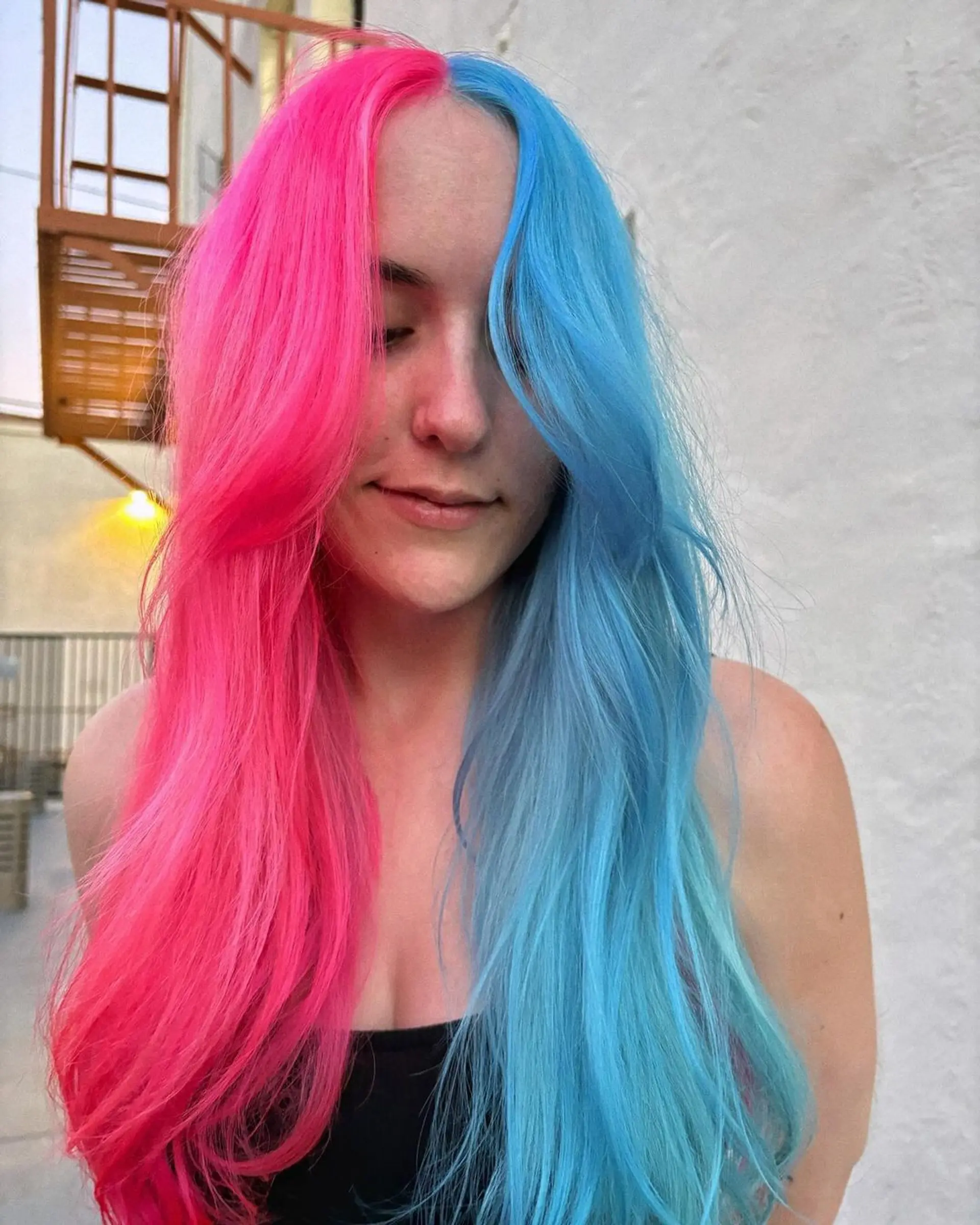 Long, straight hair with a bold split color design, featuring vivid pink on one side and electric blue on the other, enhanced with face-framing layers for added movement and texture.

@pulpriothair
Left Side - Candy
Right Side - Full Tube of Powder + 1 pea drop of Blue Muse 1