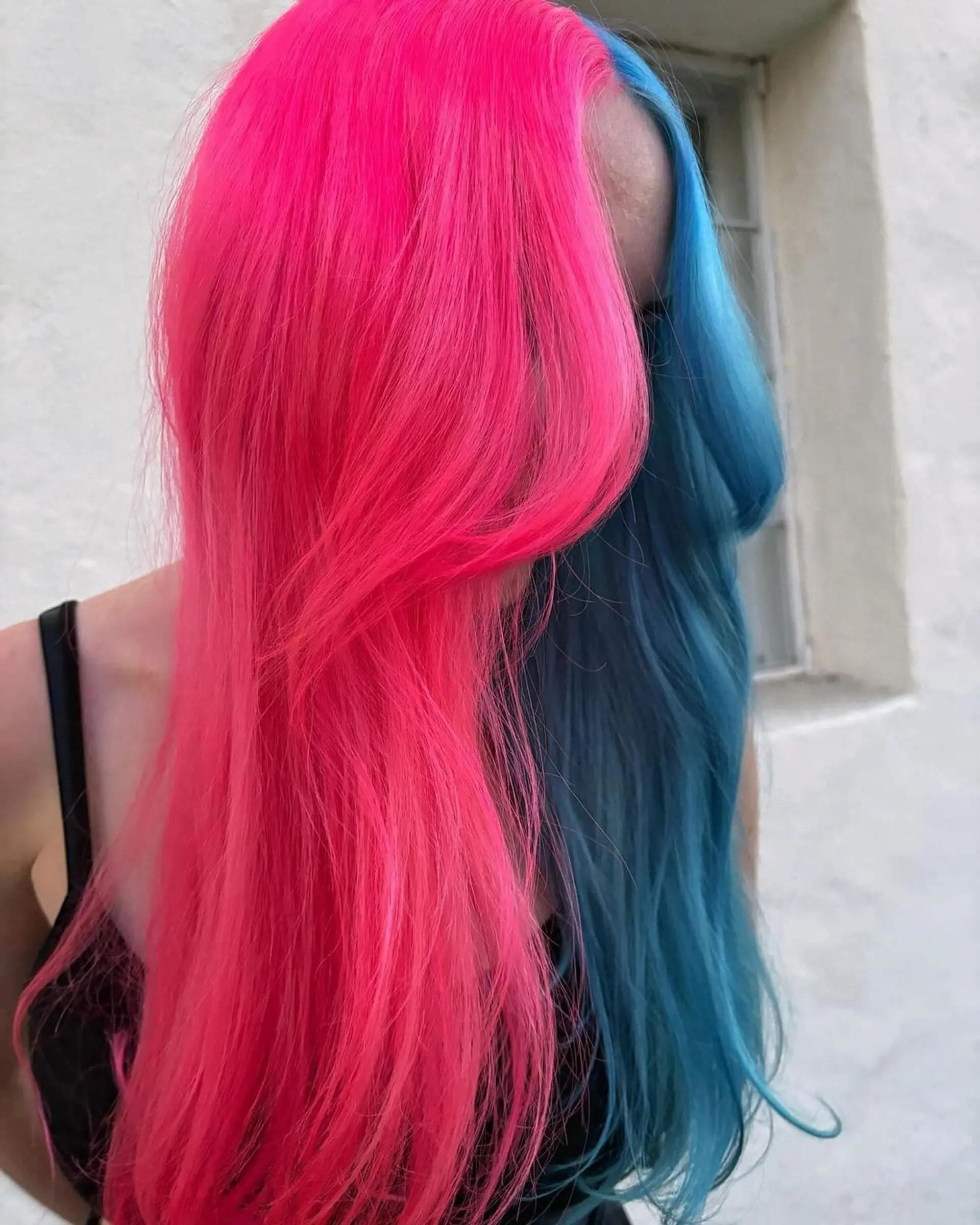 Long, straight hair with a bold split color design, featuring vivid pink on one side and electric blue on the other, enhanced with face-framing layers for added movement and texture.

@pulpriothair
Left Side - Candy
Right Side - Full Tube of Powder + 1 pea drop of Blue Muse 2