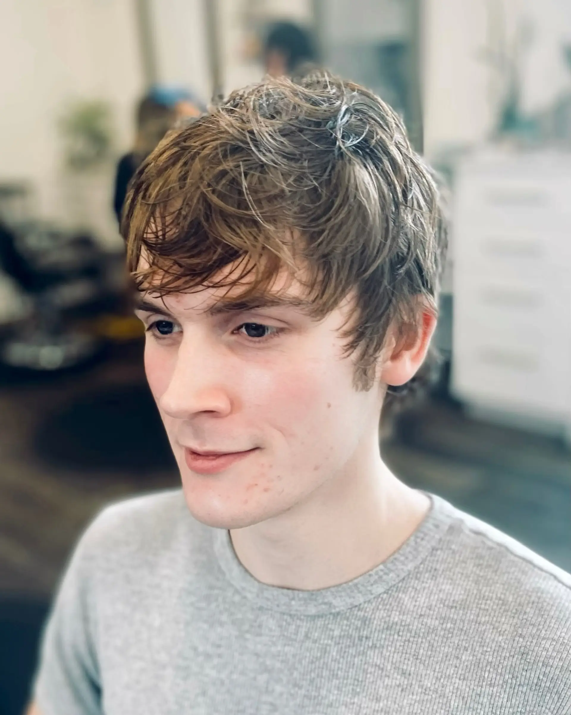 A textured short haircut featuring piecey layers throughout the top and a softly parted fringe. 1