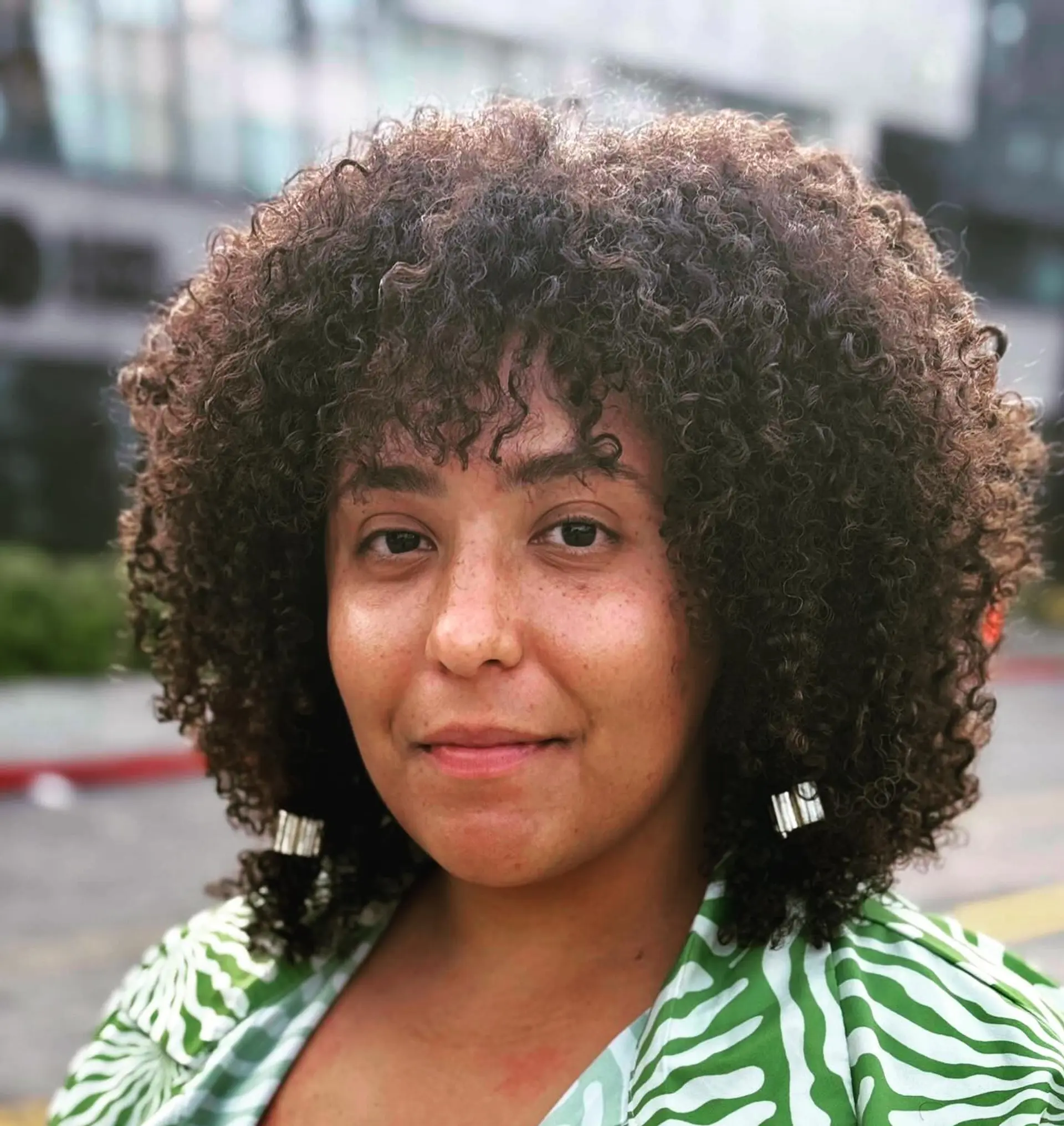 Medium length curly afro with natural texture. 1