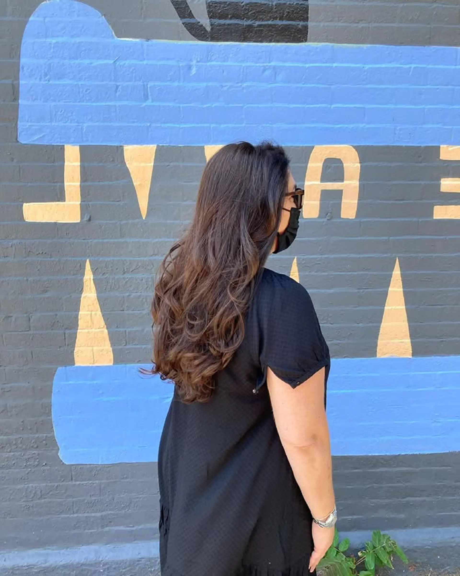 A long, layered hairstyle with natural waves and plenty of volume. 1