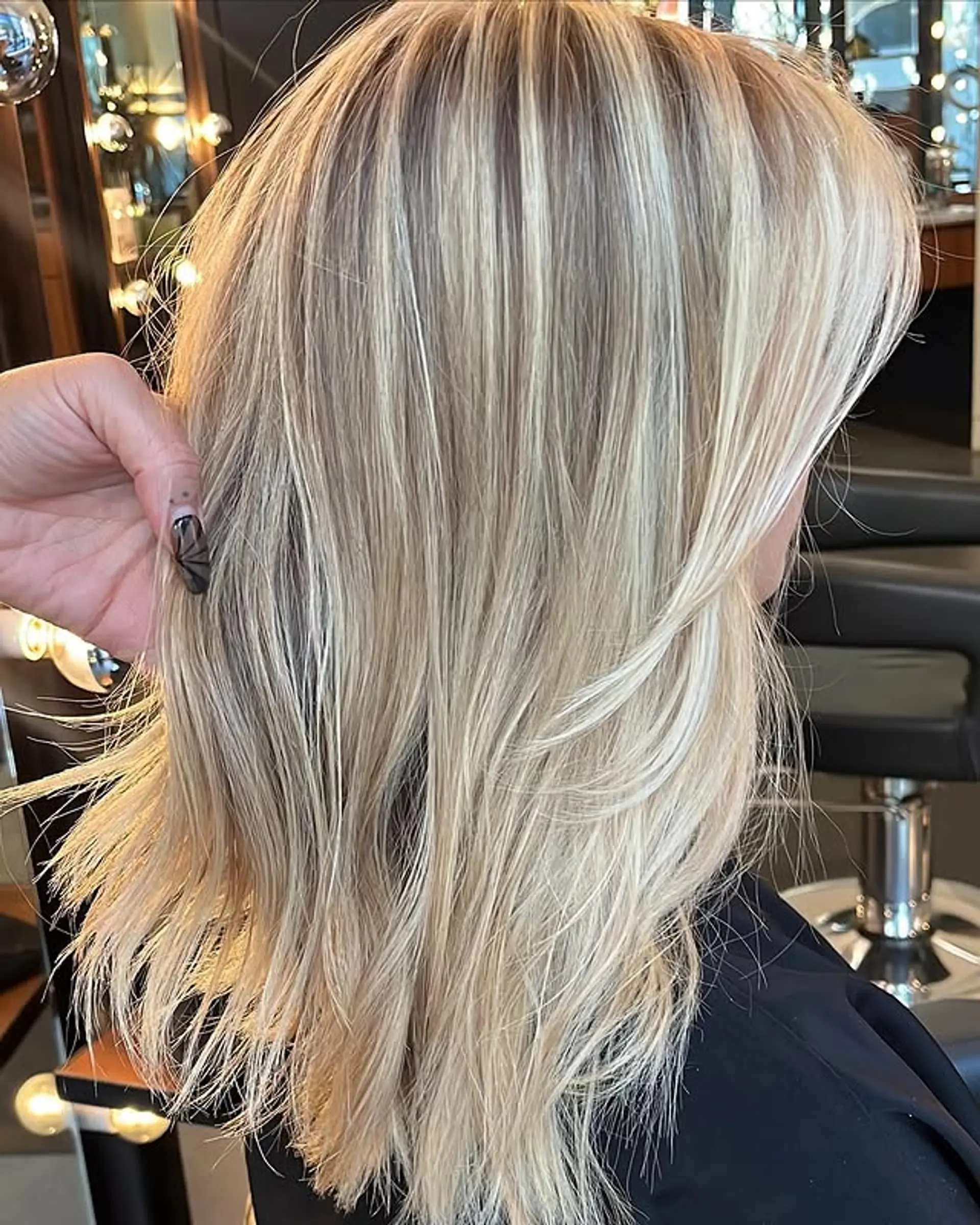 A medium-length, layered bob with face-framing layers. 1