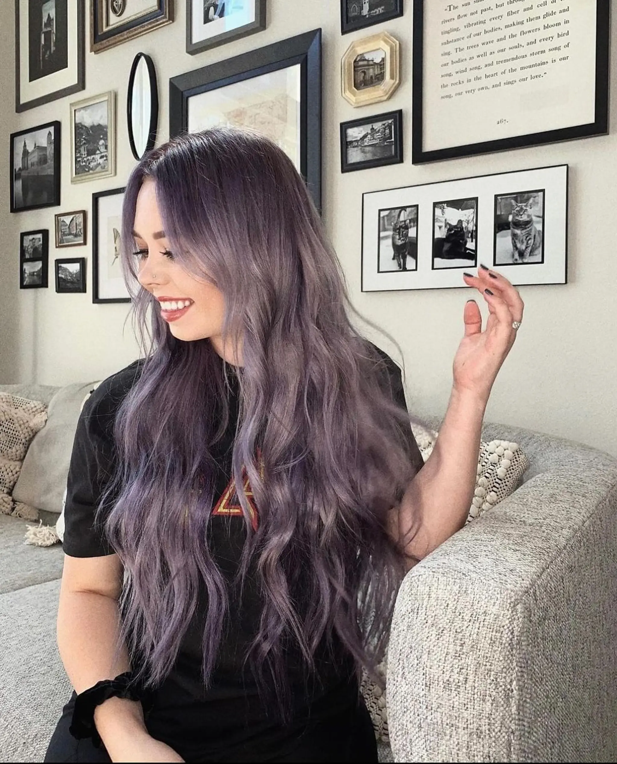 Loose, wavy layers cascade down in a harmonious gradient of lavender and purple tones, parted neatly in the center. 1