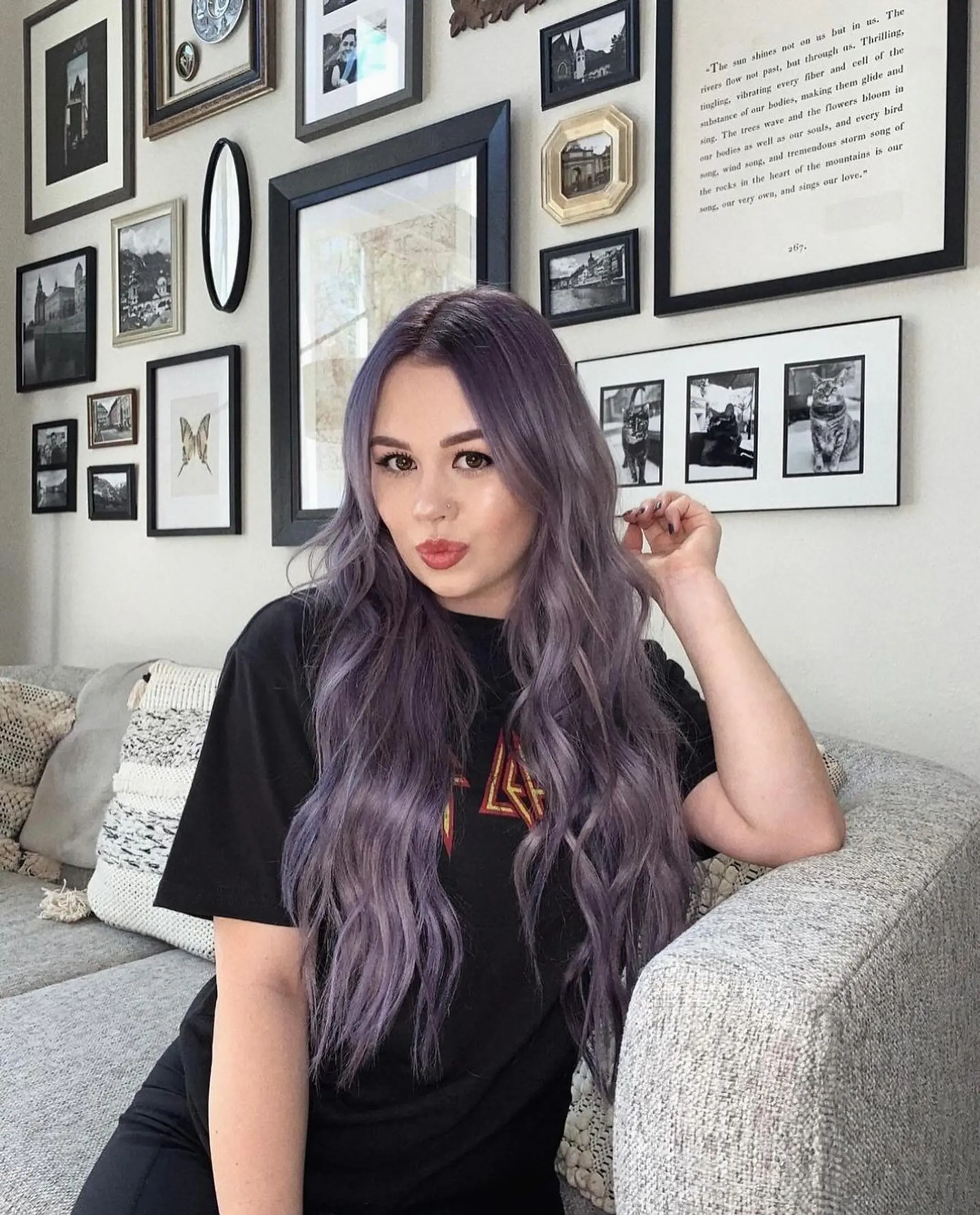 Loose, wavy layers cascade down in a harmonious gradient of lavender and purple tones, parted neatly in the center. 2