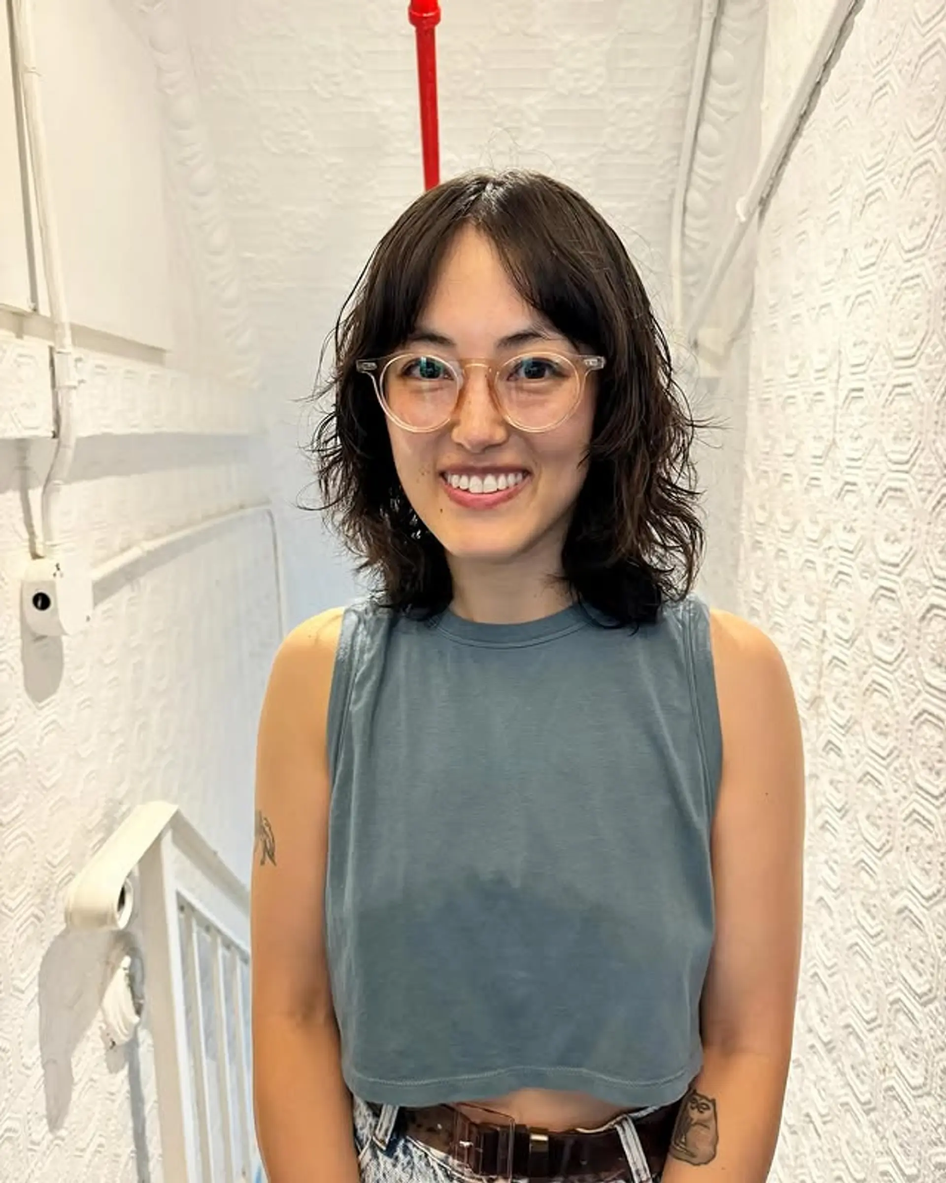 A choppy, layered shag with curtain bangs. 1