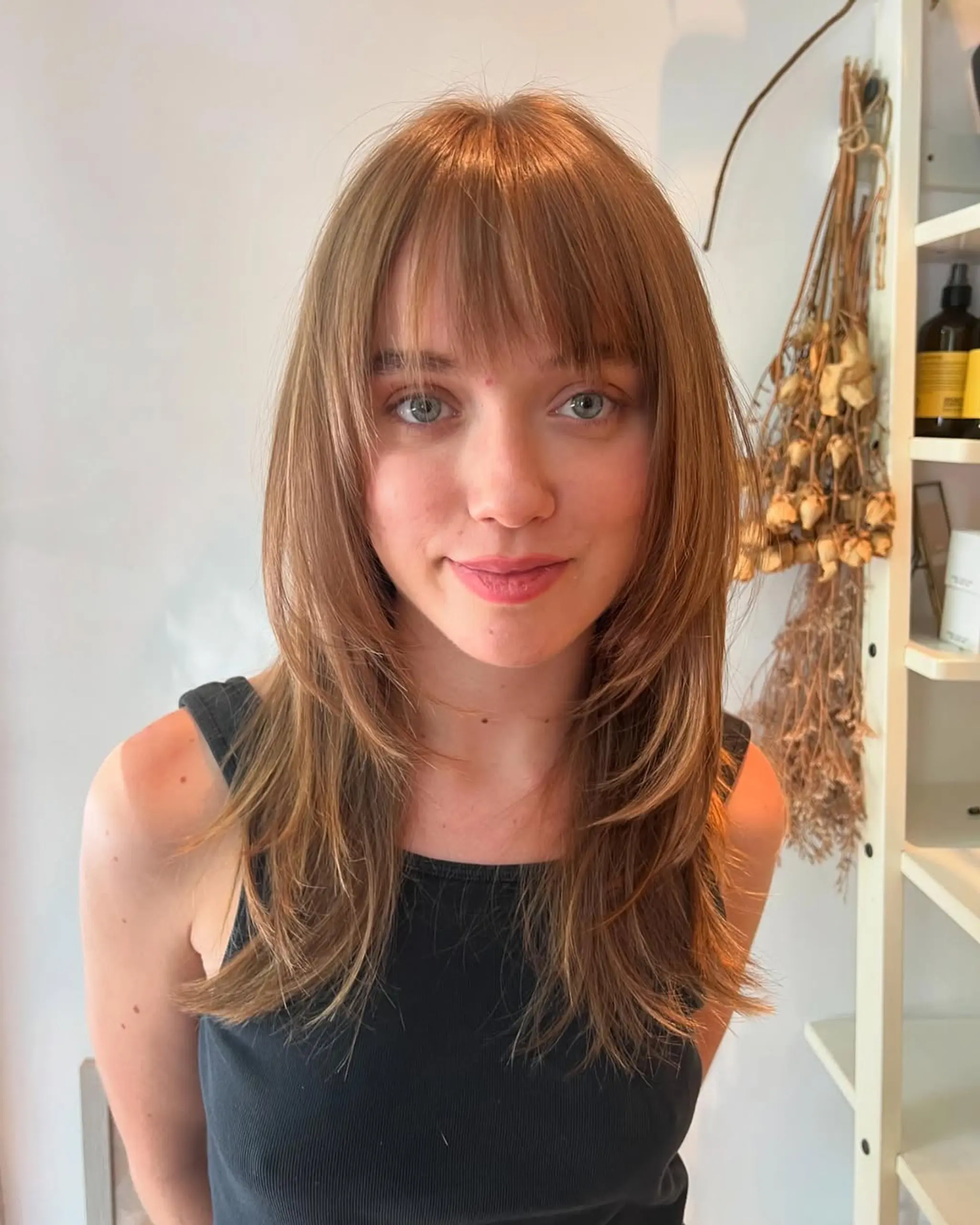 A medium-length shag with layered, face-framing layers and wispy bangs. 1