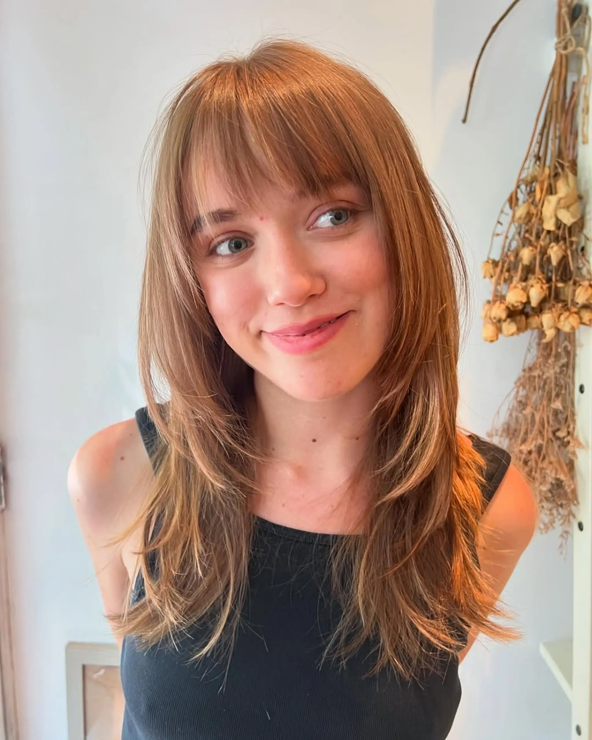 A medium-length shag with layered, face-framing layers and wispy bangs. 2
