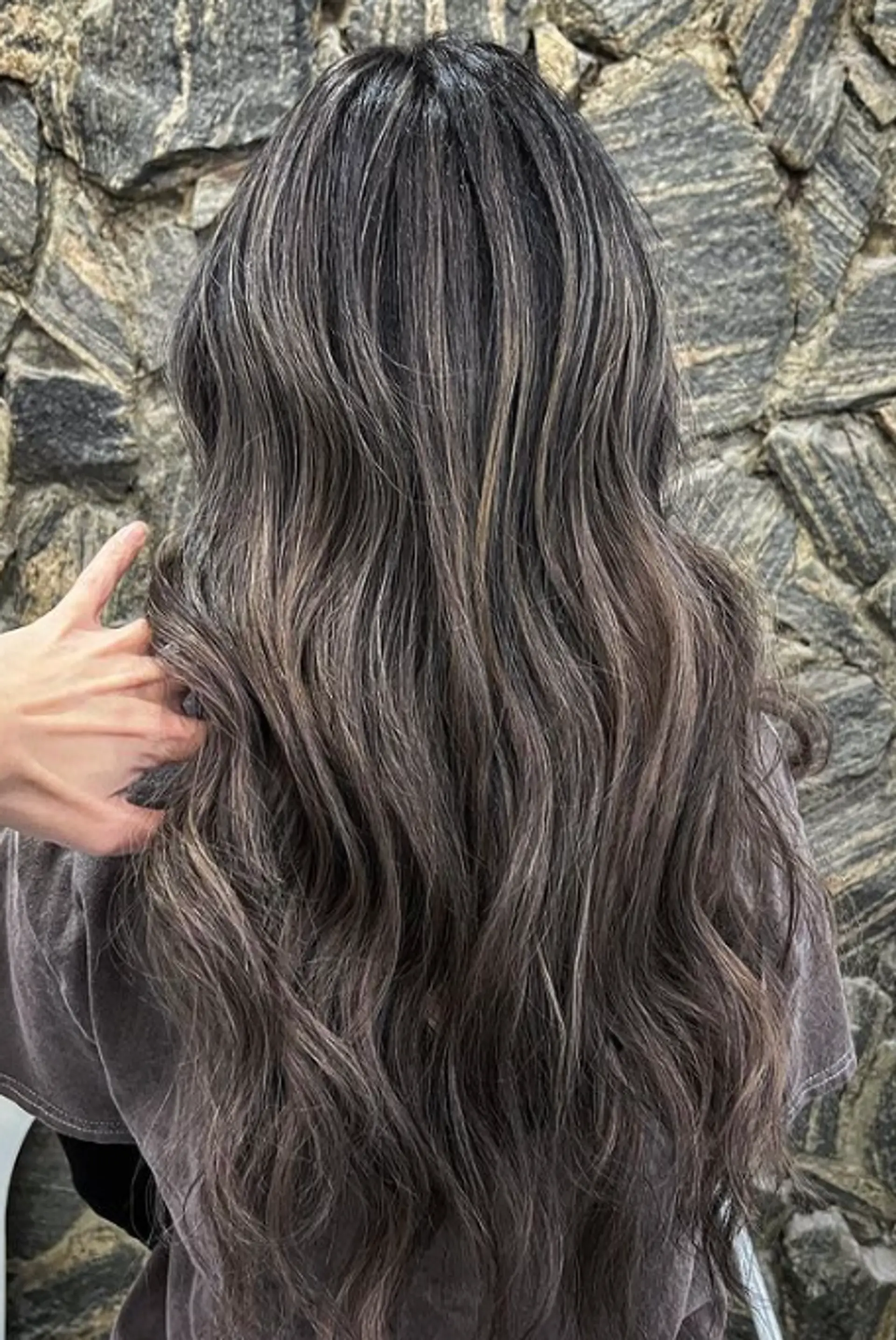 Long, wavy hair with a soft texture, featuring a gradient of silver, ash gray, and charcoal hues. 1
