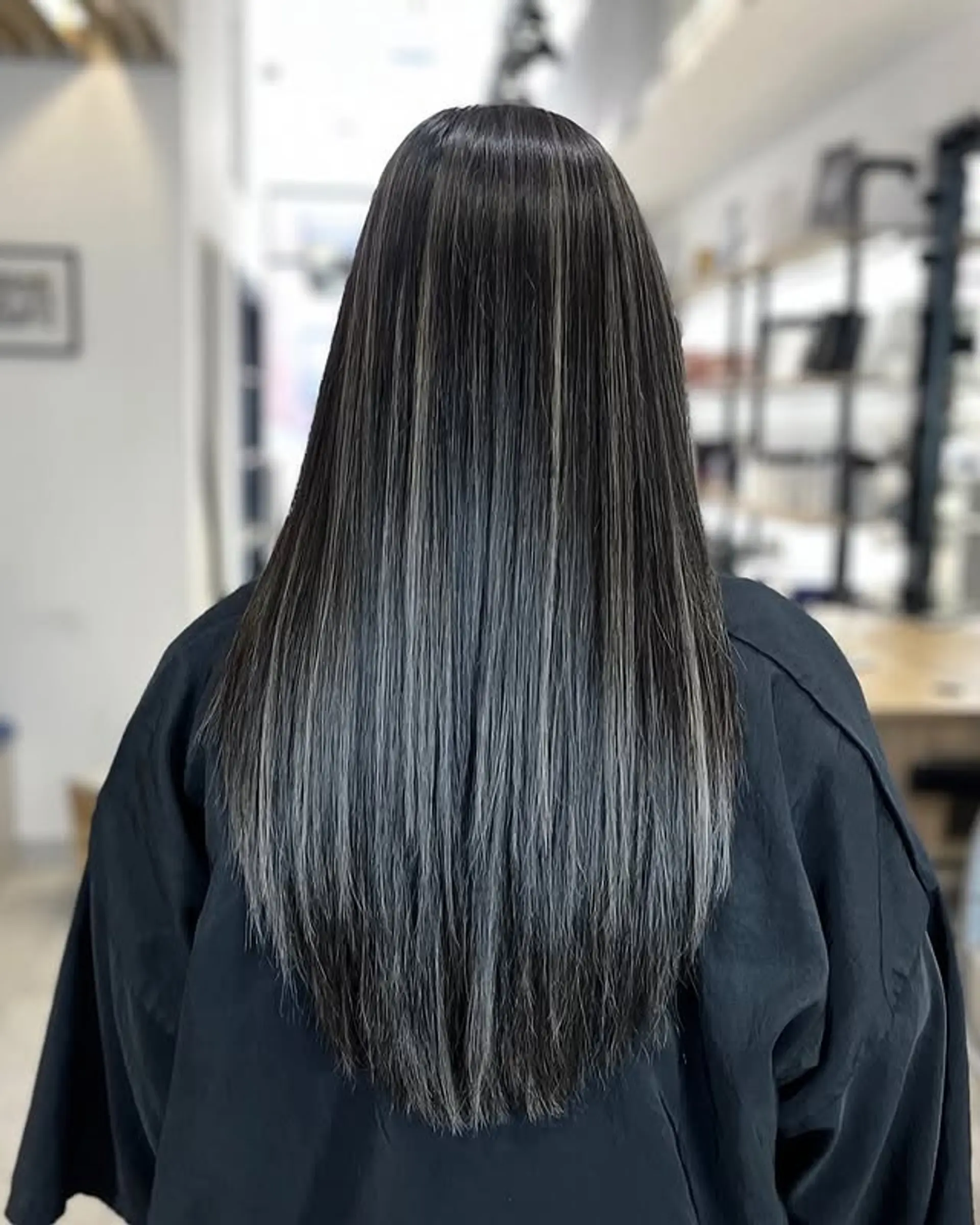 Long straight hair with striking silver highlights. 1