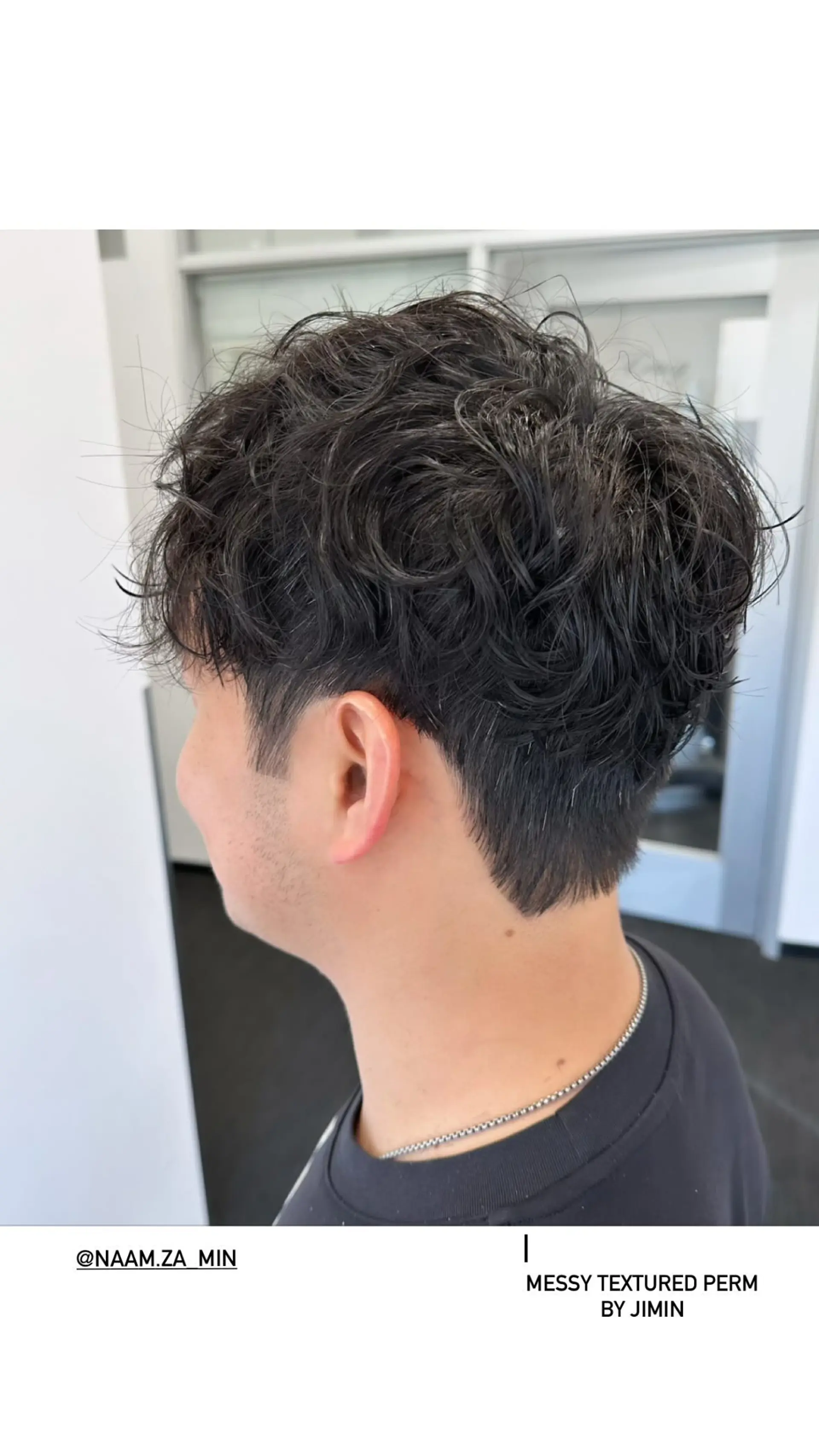 A textured, wavy perm with tapered sides. 1