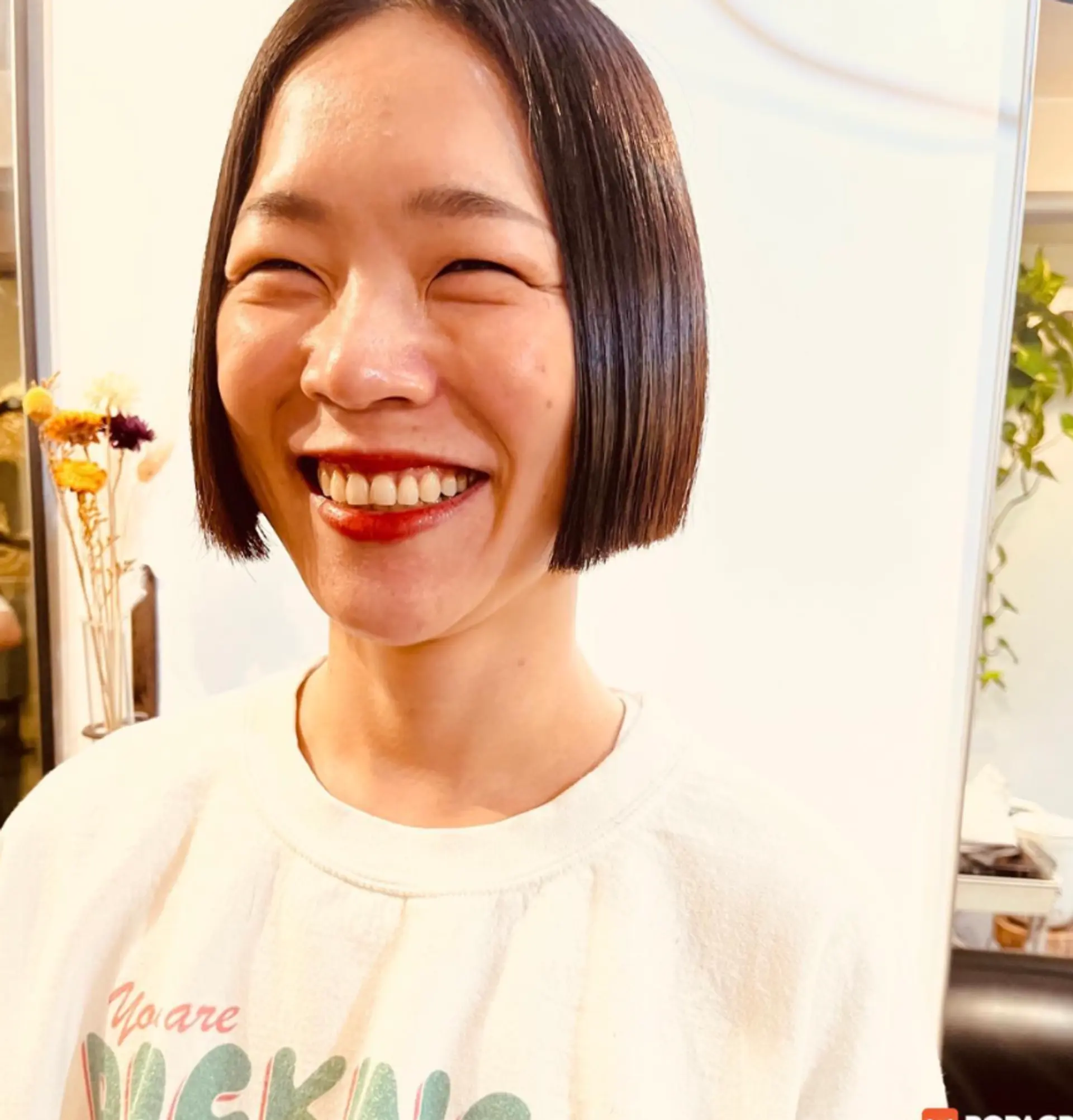 A sleek, blunt bob haircut with a clean, even line. 1