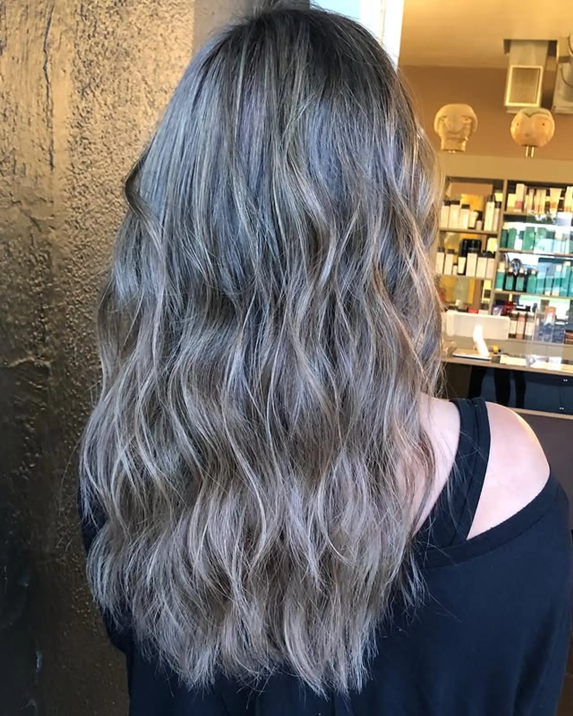 A long, wavy hairstyle featuring an ash blonde balayage. 1