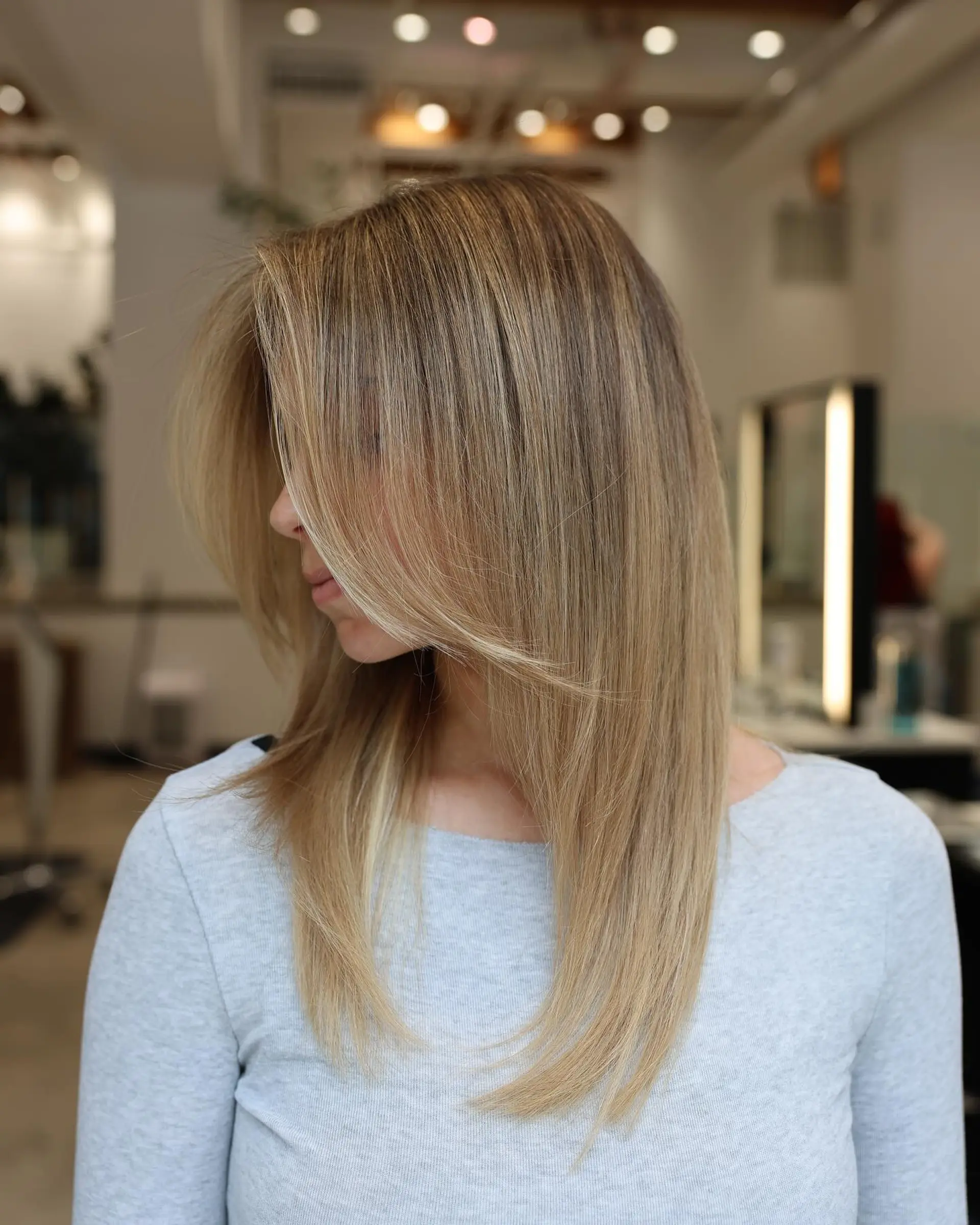 A long layered haircut with face-framing layers for straight hair. 1