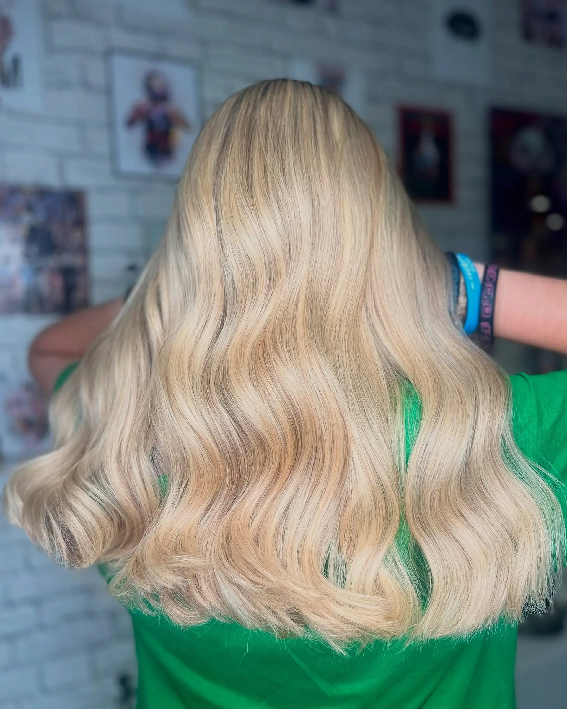 Long, wavy golden blonde hair with natural waves and subtle layers. 2