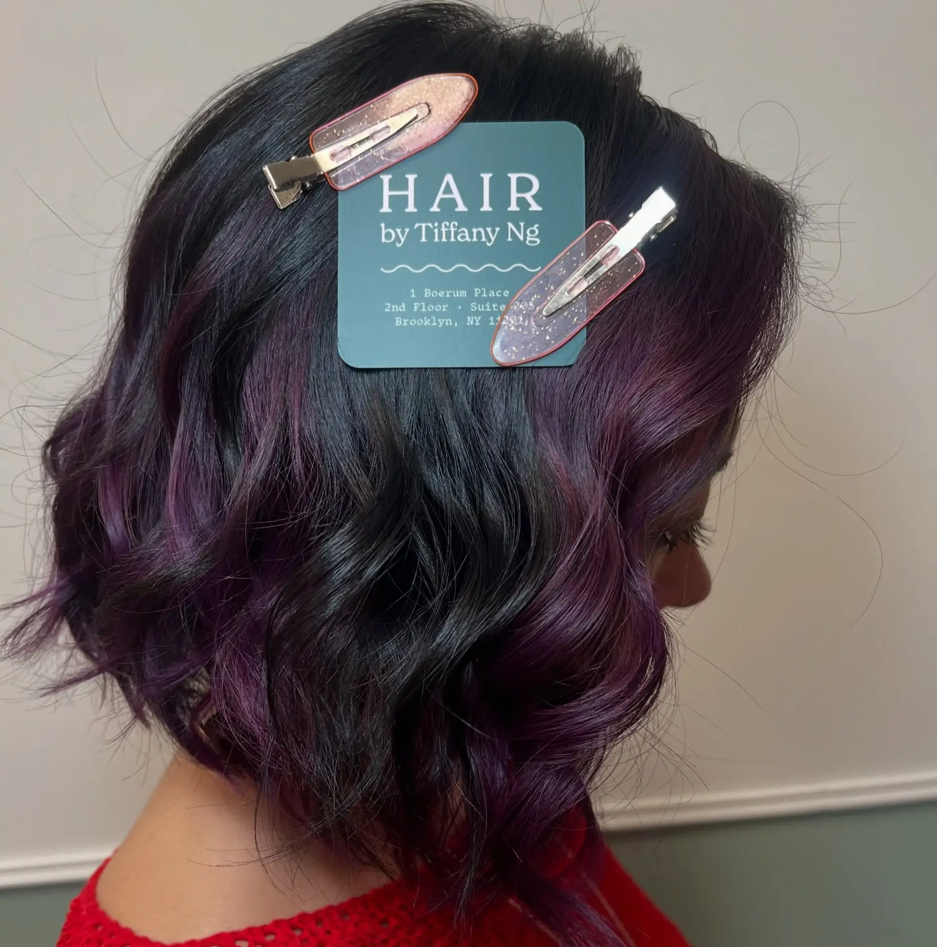 A textured, wavy bob featuring a dark base with rich deep purple and violet balayage accents. 1