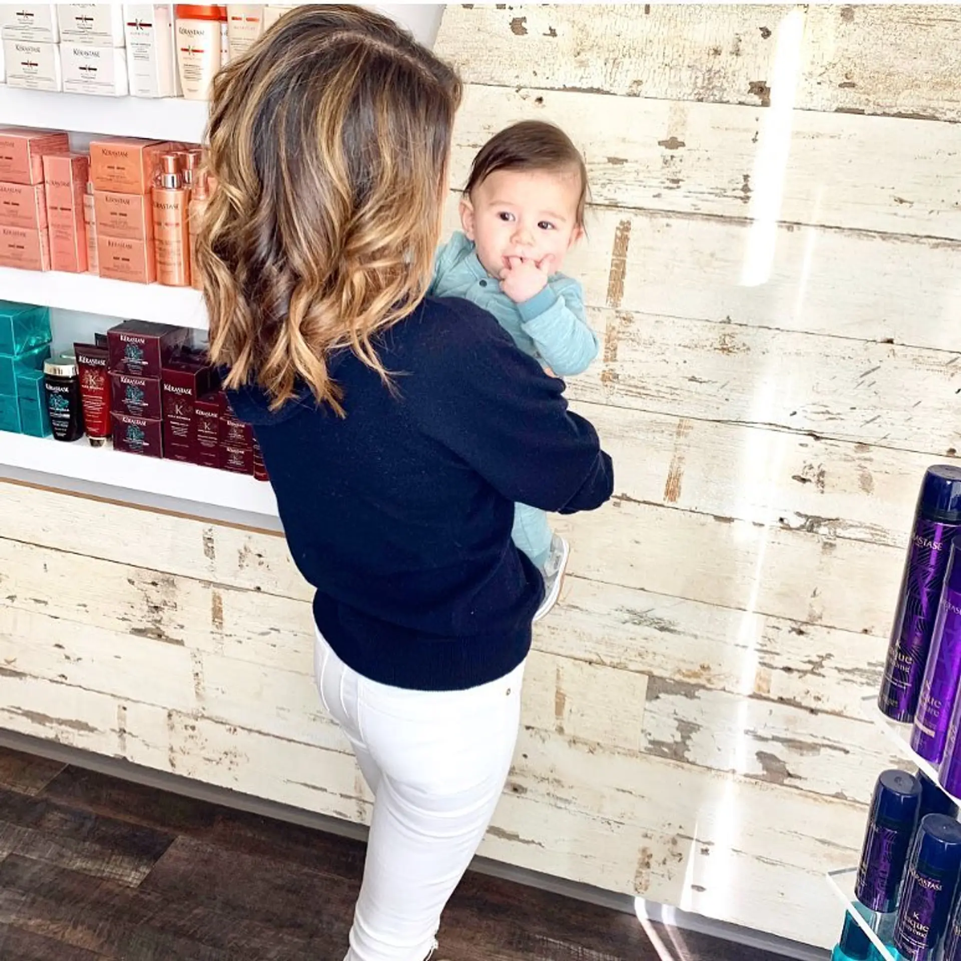 Medium-length dimensional bronde balayage styled with soft, loose waves. 1