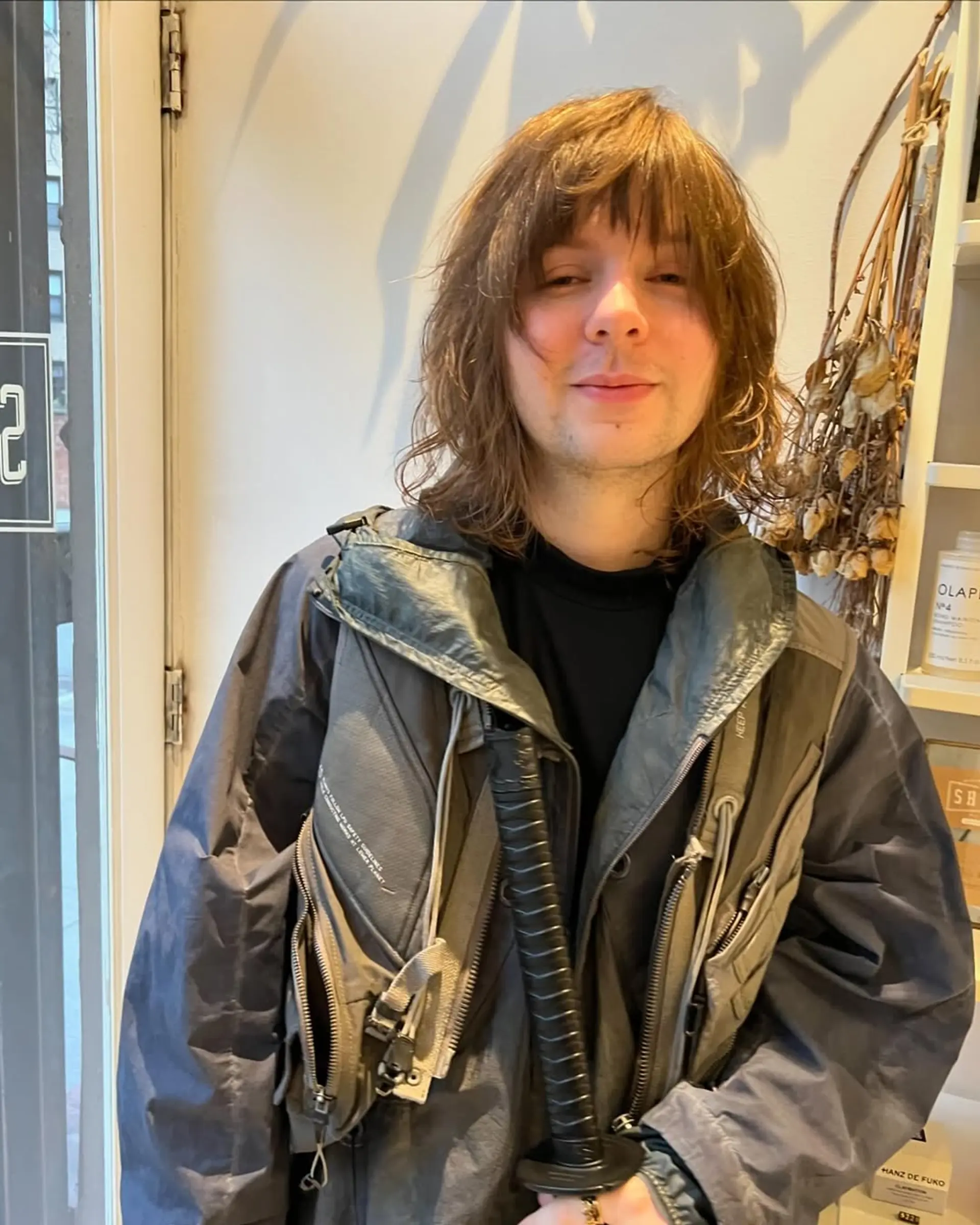 A modern take on the classic mullet, featuring shaggy layers and textured waves with bangs. 1