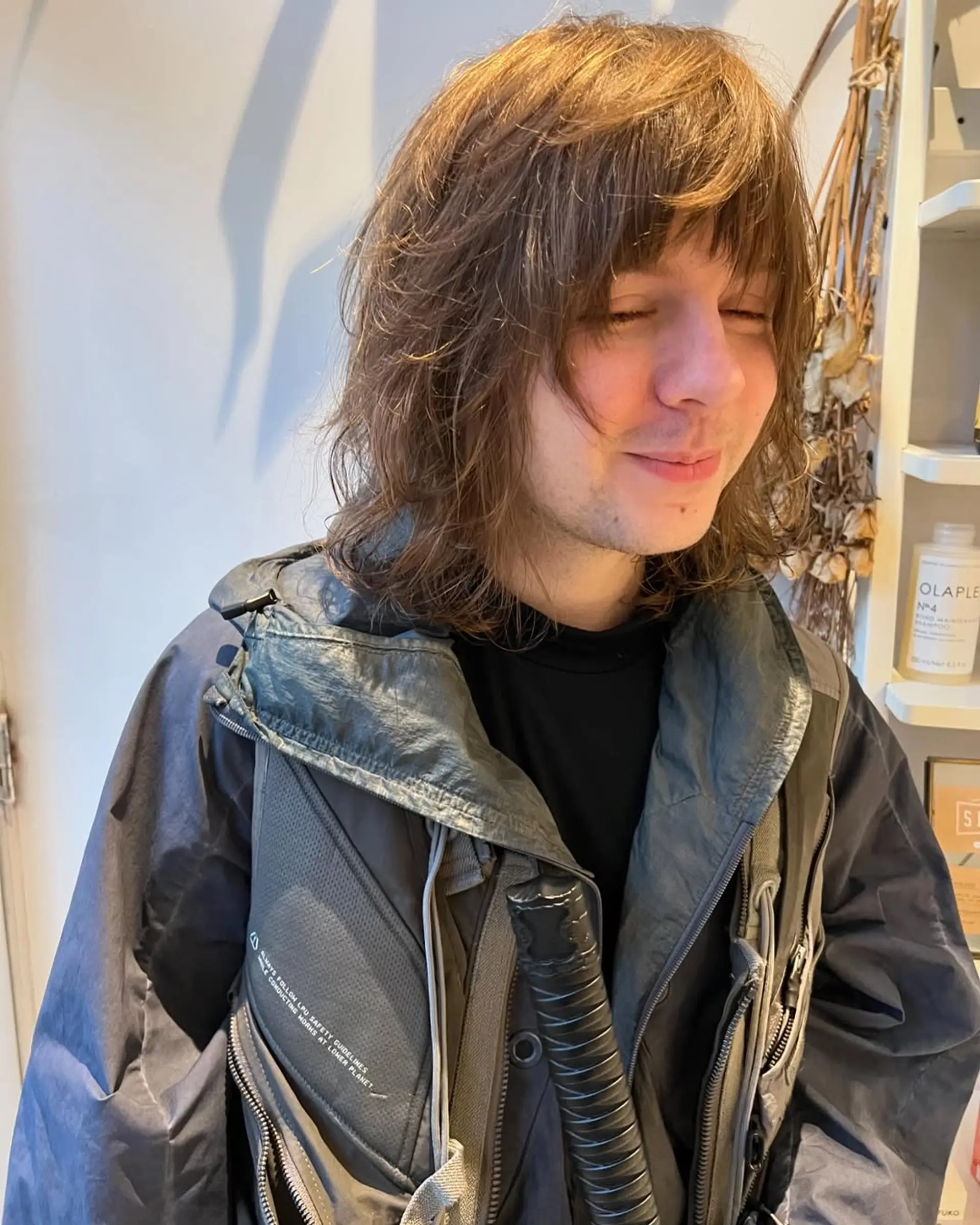 A modern take on the classic mullet, featuring shaggy layers and textured waves with bangs. 2