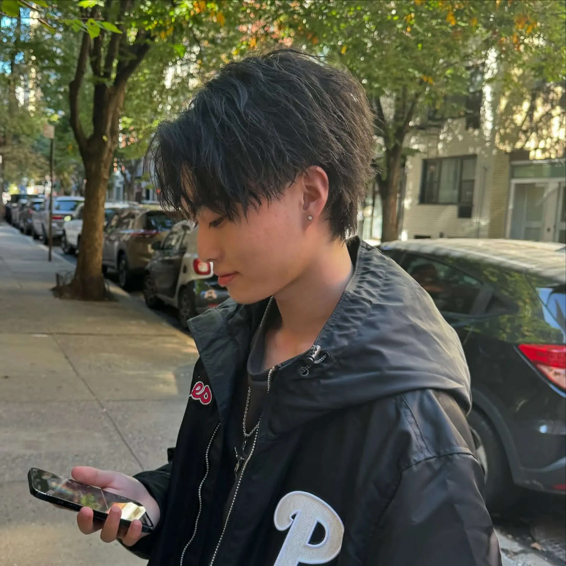 A textured, layered cut with a messy fringe and natural volume, capturing a popular modern K-pop aesthetic. 1