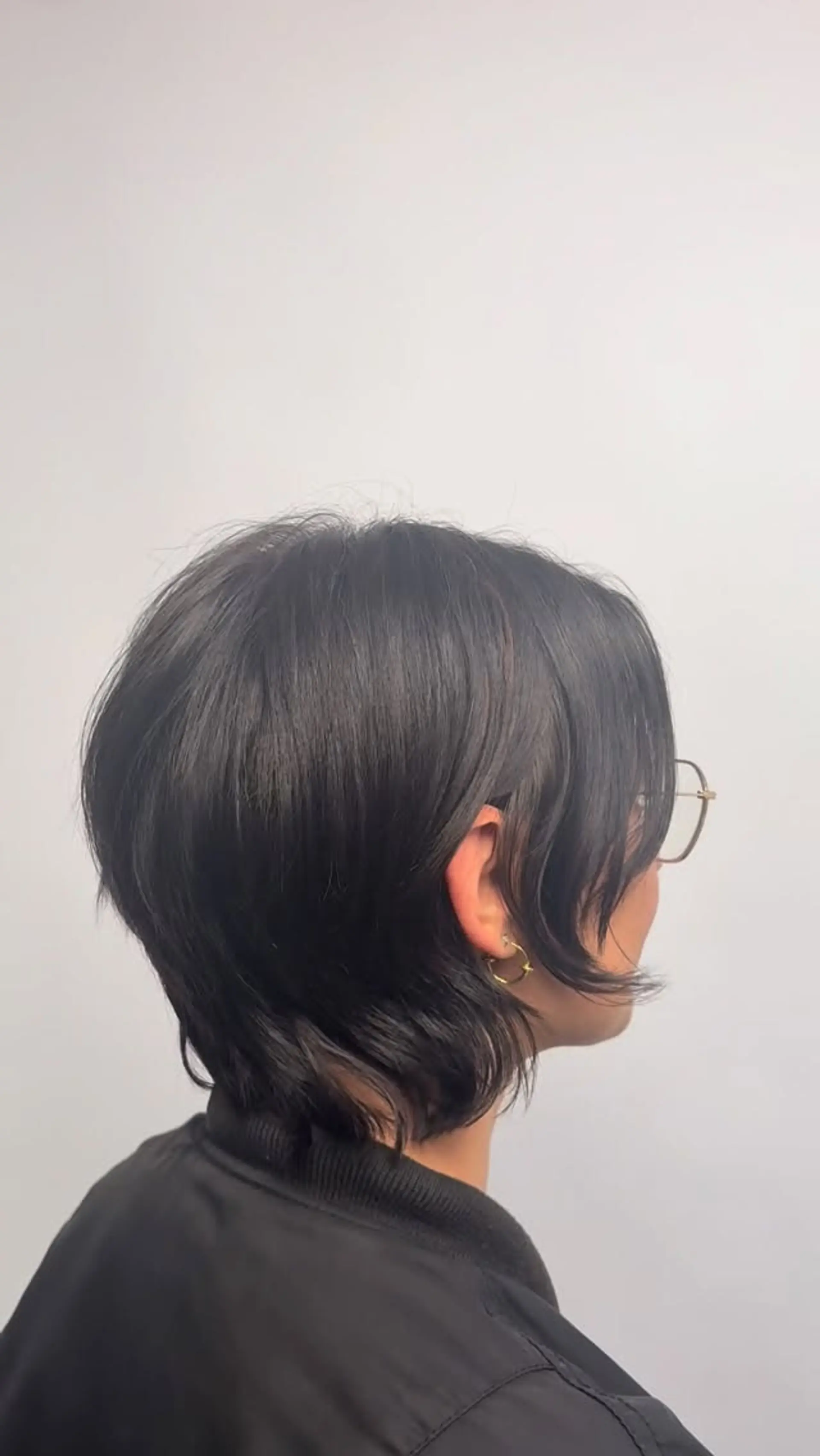 A textured, layered bixie cut featuring soft face-framing layers and flicked ends at the nape. 1