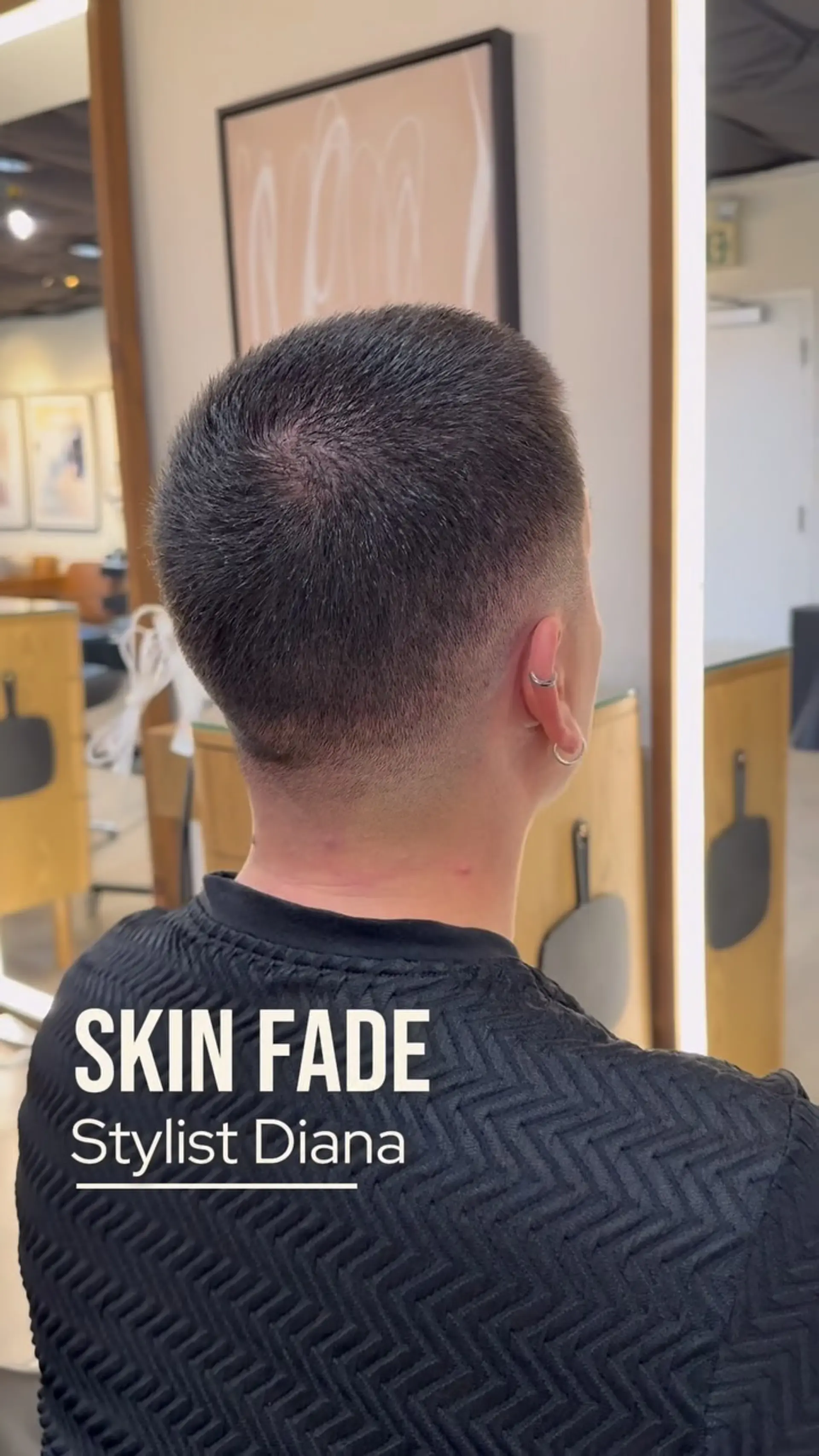 A clean, seamless skin fade tapering down to the bare neck with a short, neat length on top. 1